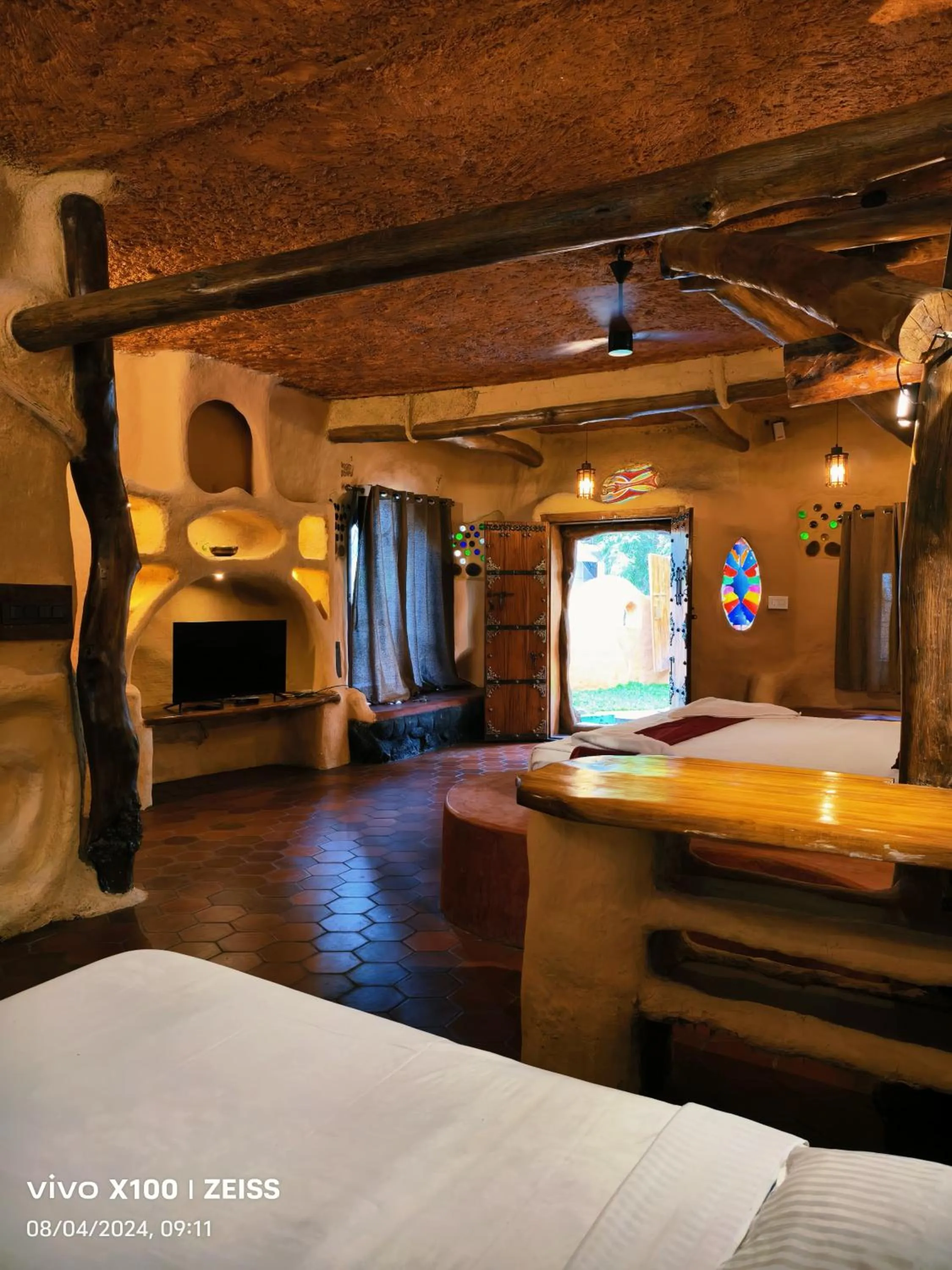 Communal lounge/ TV room, Bed in Udaya Resort