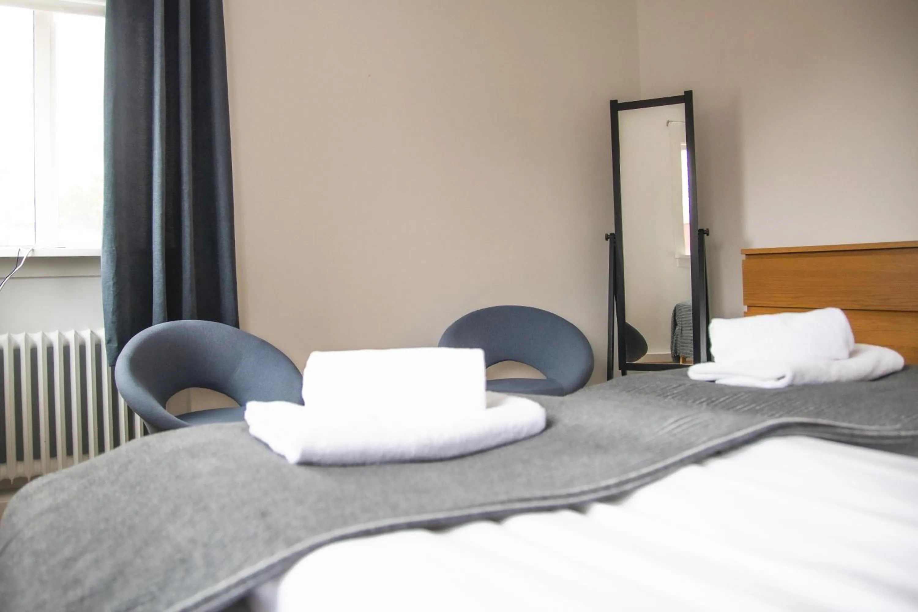 Seating area, Bed in Setrið Guesthouse