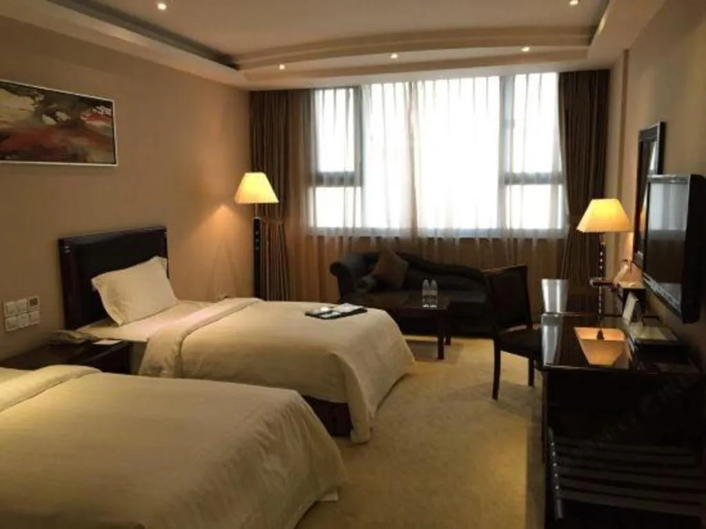 Bed in Dongguan Metropolitan Yijing Hotel