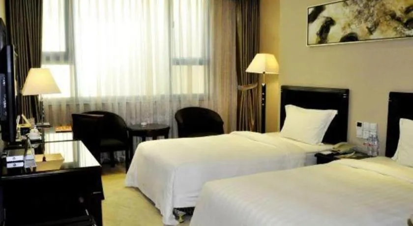 Bed in Dongguan Metropolitan Yijing Hotel