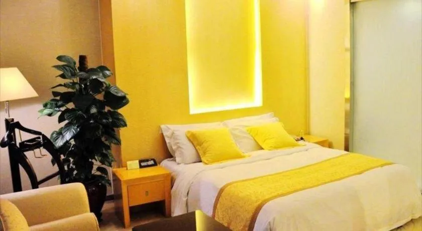 Bed in Dongguan Metropolitan Yijing Hotel