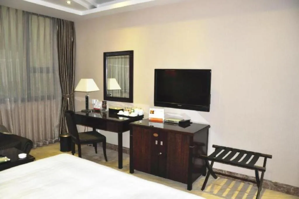 Bed in Dongguan Metropolitan Yijing Hotel