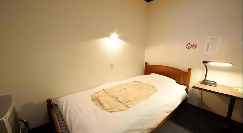 Bed in Itabashi Hotel Hilltop