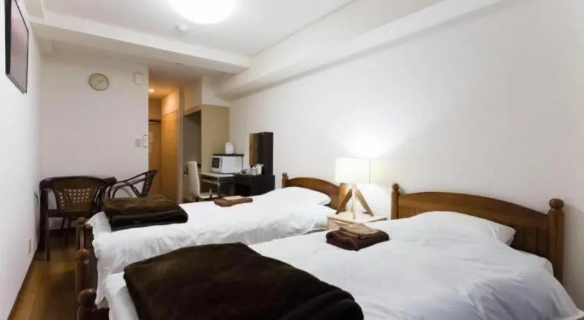 Bed in Itabashi Hotel Hilltop