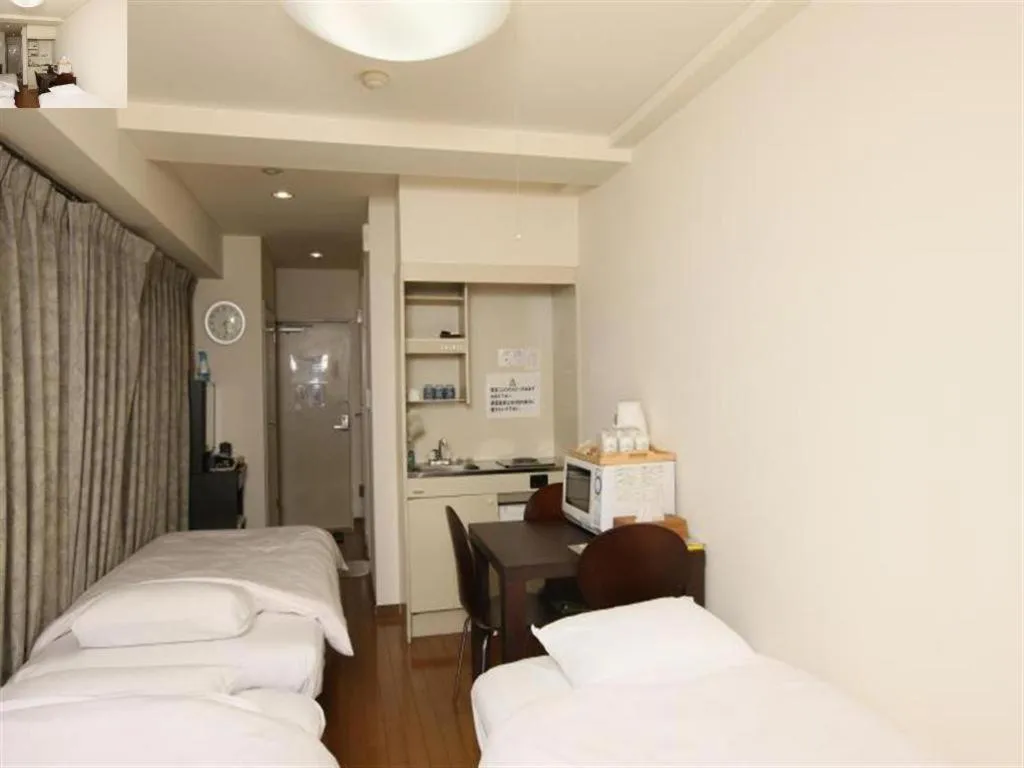 Bed in Itabashi Hotel Hilltop