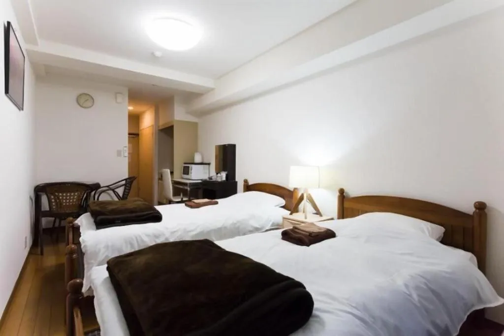 Bed in Itabashi Hotel Hilltop