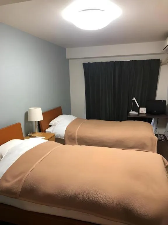 Bed in Itabashi Hotel Hilltop