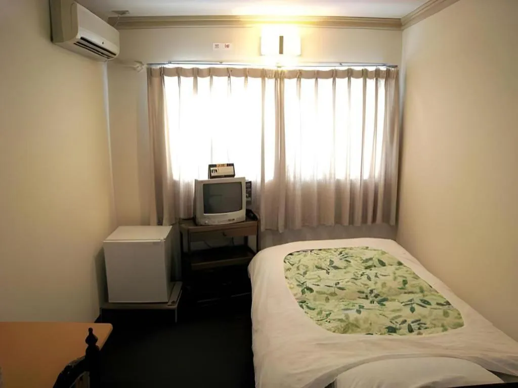 Bed in Itabashi Hotel Hilltop