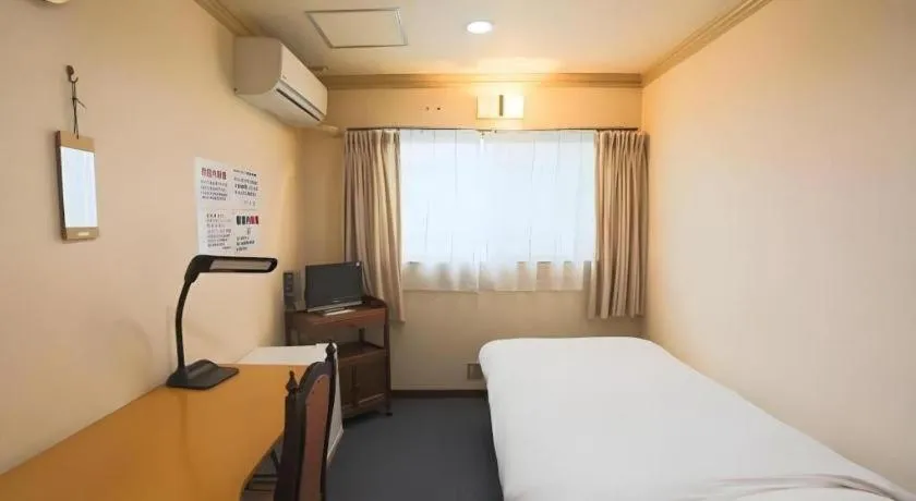 Bed in Itabashi Hotel Hilltop