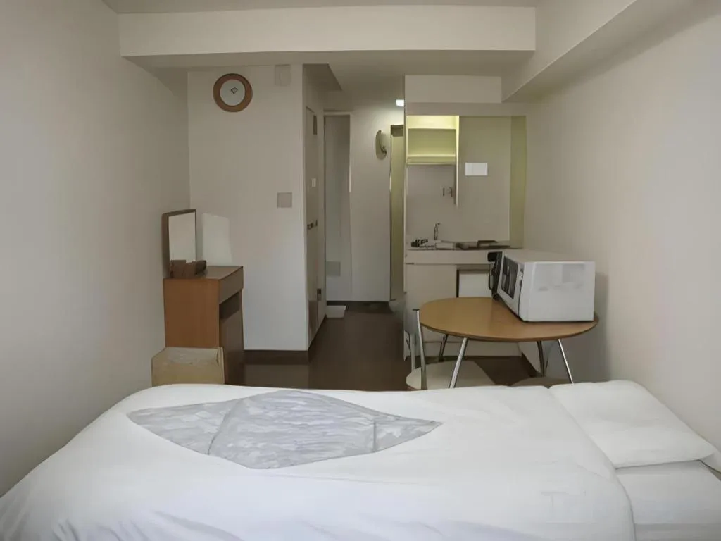 Bed in Itabashi Hotel Hilltop