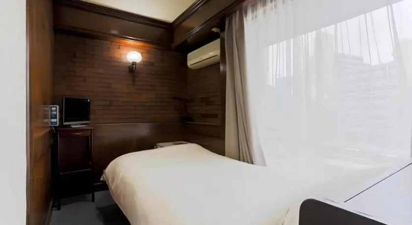 Bed in Itabashi Hotel Hilltop