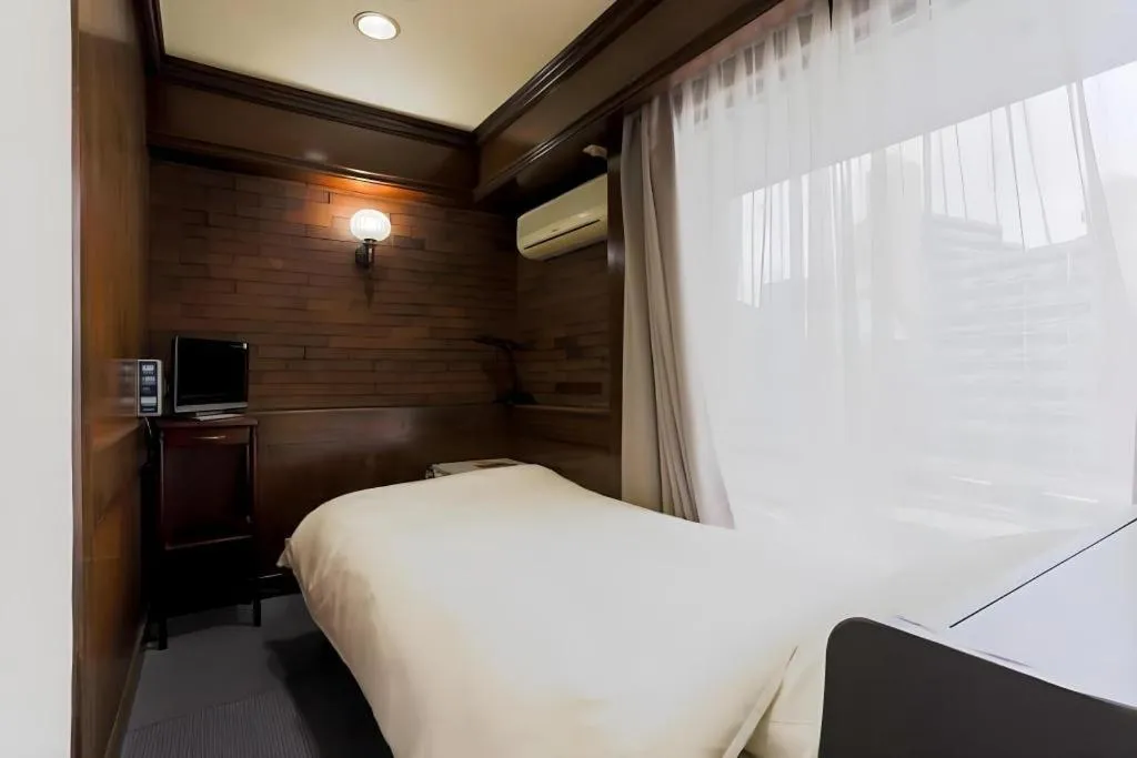 Bed in Itabashi Hotel Hilltop