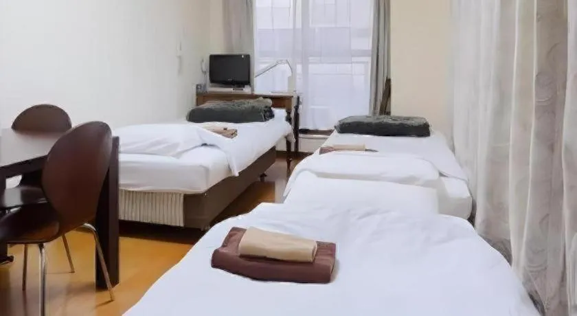 Bed in Itabashi Hotel Hilltop