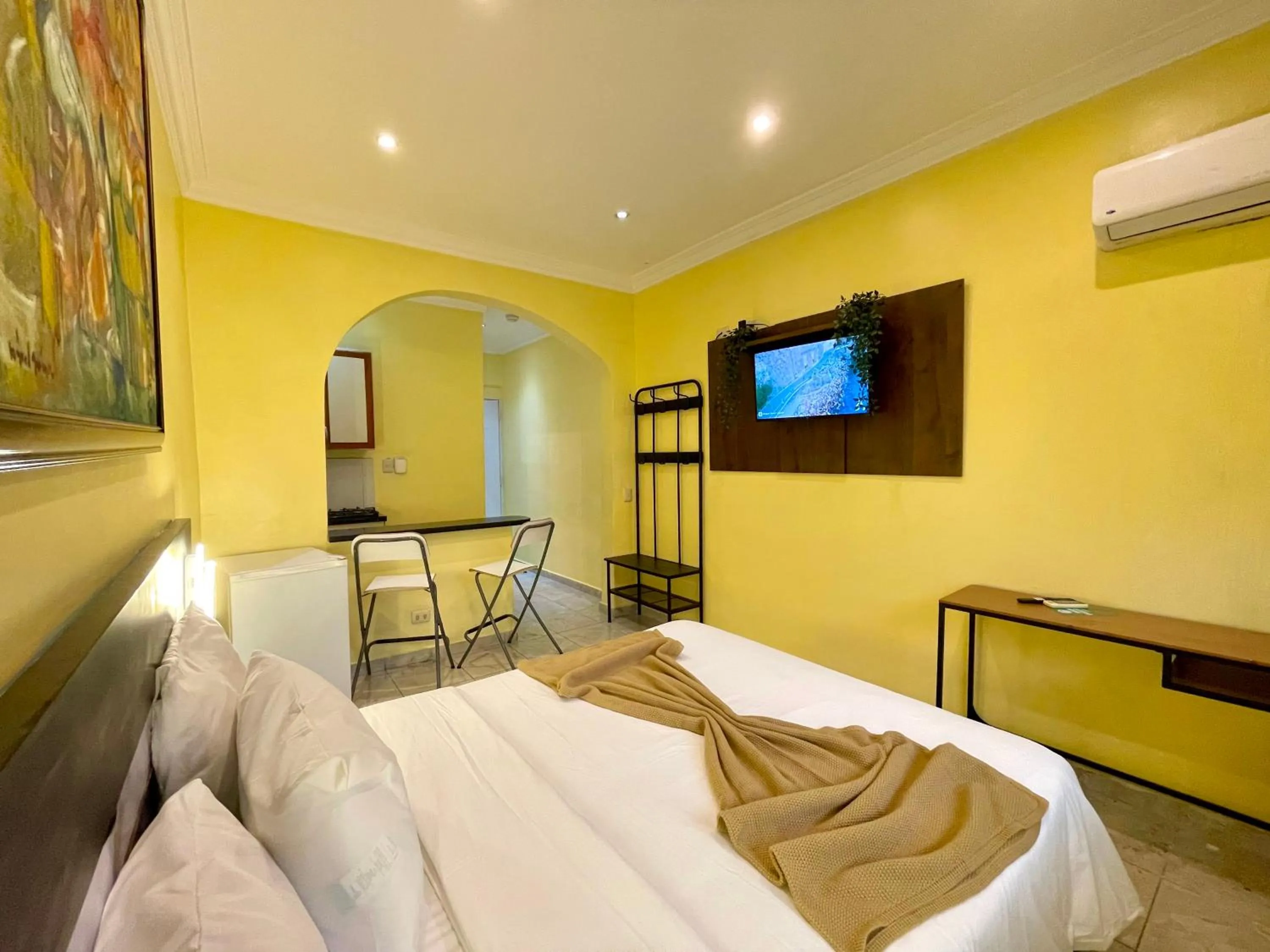 Communal lounge/ TV room, Bed in RIG Puerto Malecón