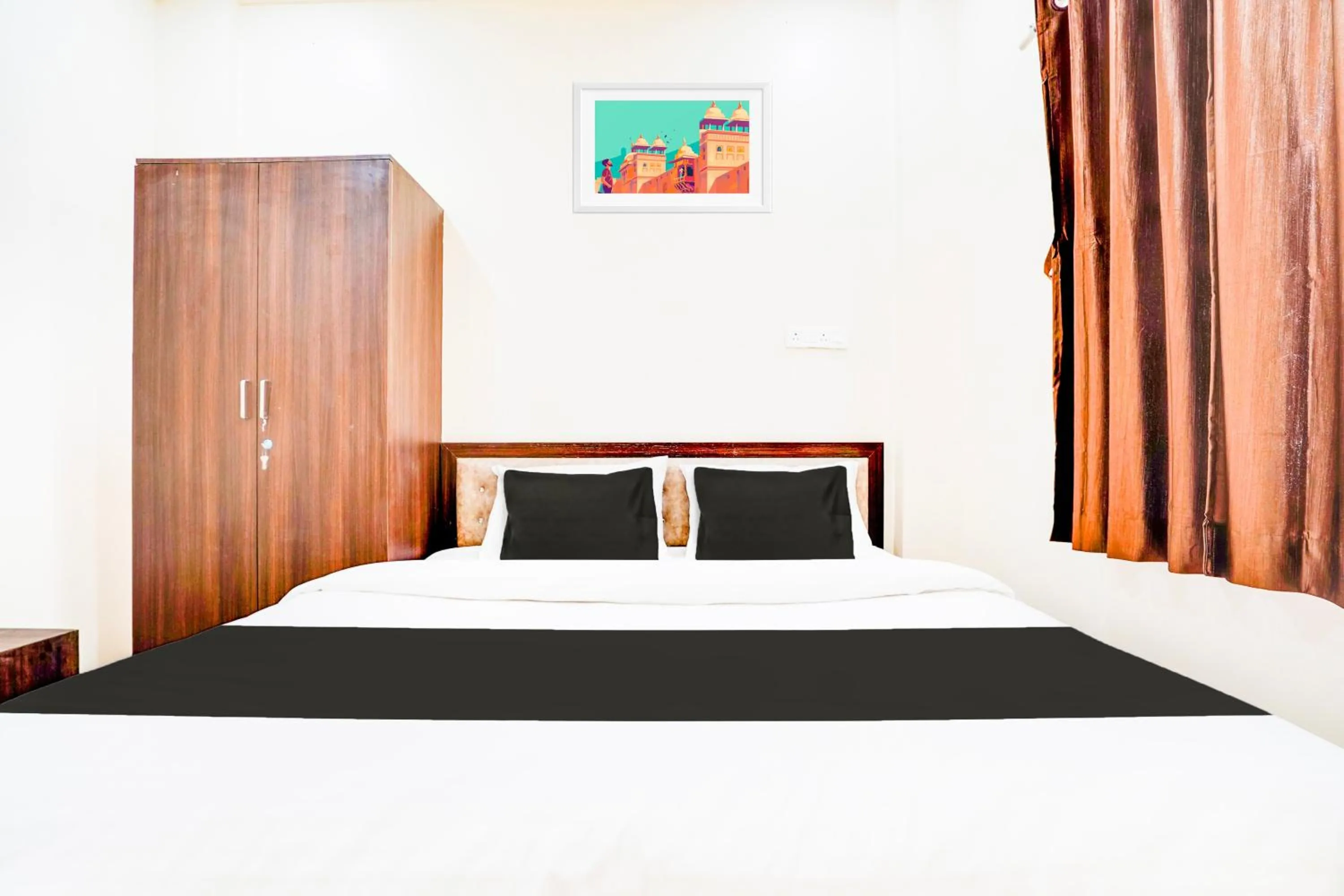 Bedroom in Hotel O UTS STAY IN