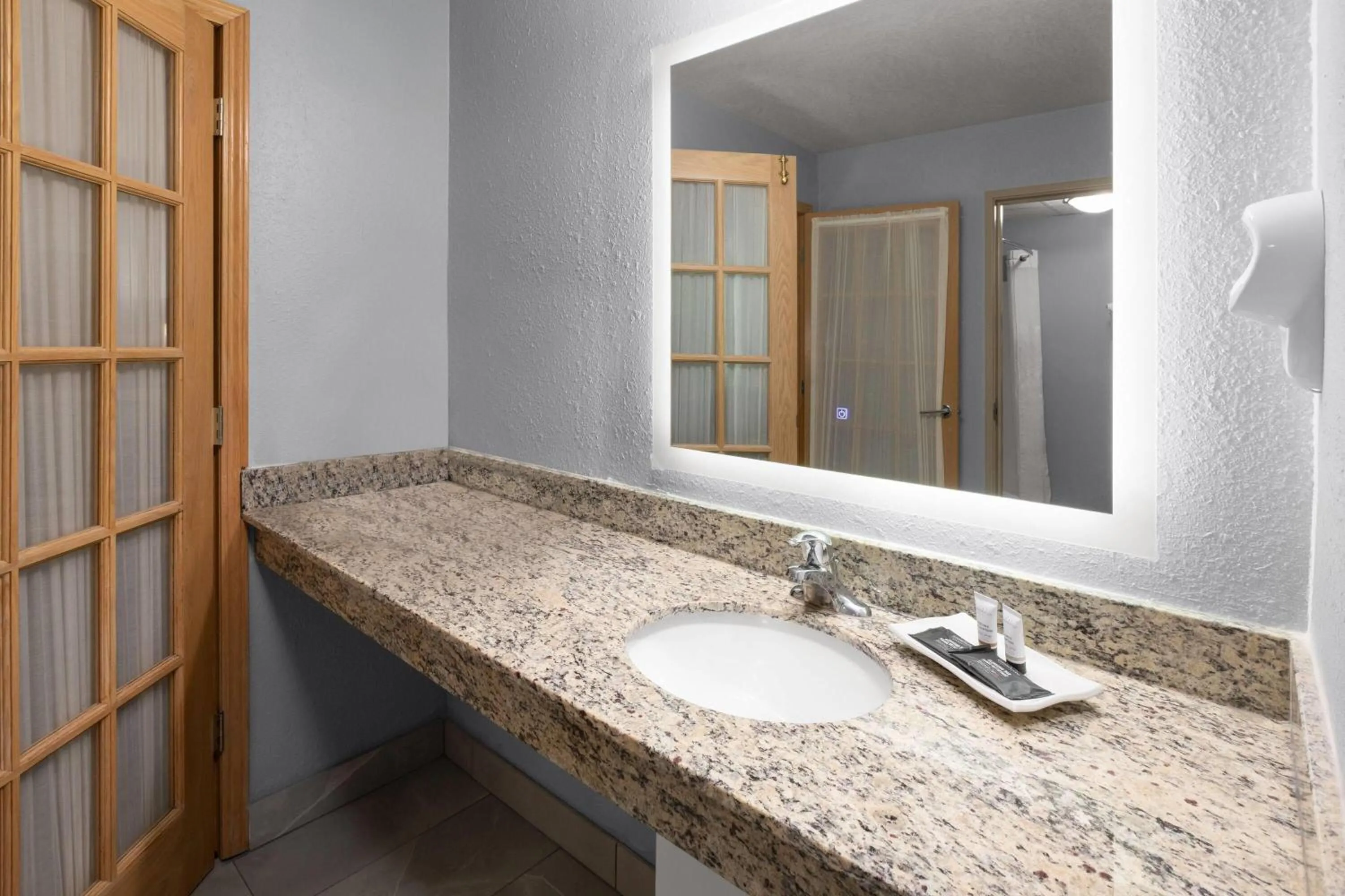 Bathroom in AmericInn by Wyndham Douglas/Saugatuck