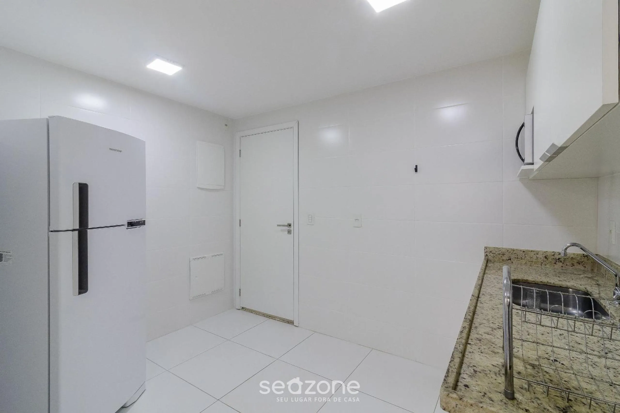 Kitchen or kitchenette in Encantador apto em Cabo Frio SDA311
