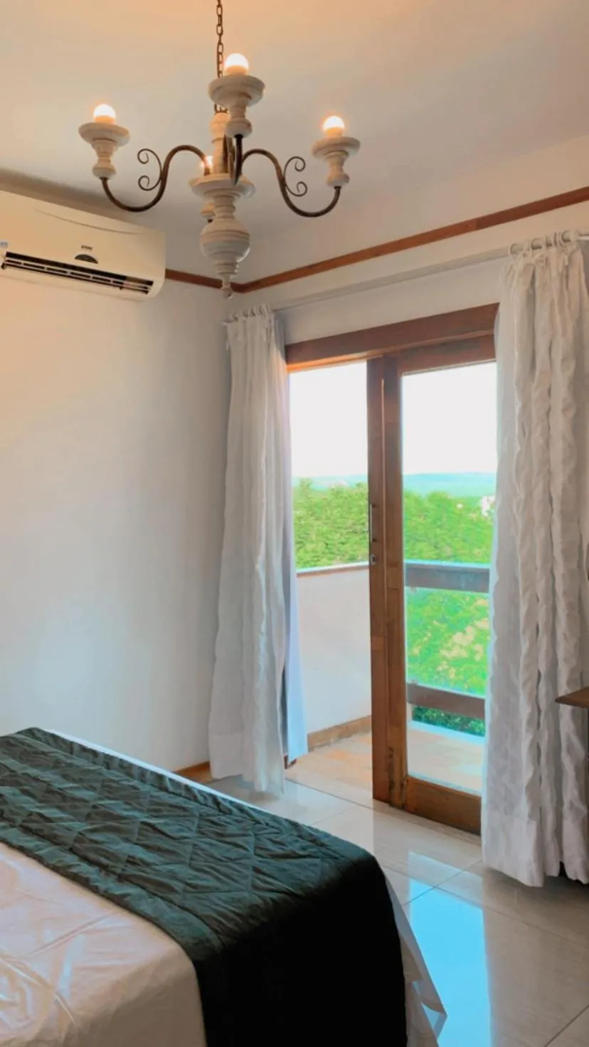 Balcony/Terrace, Bed in Hotel Vila Nova do Príncipe