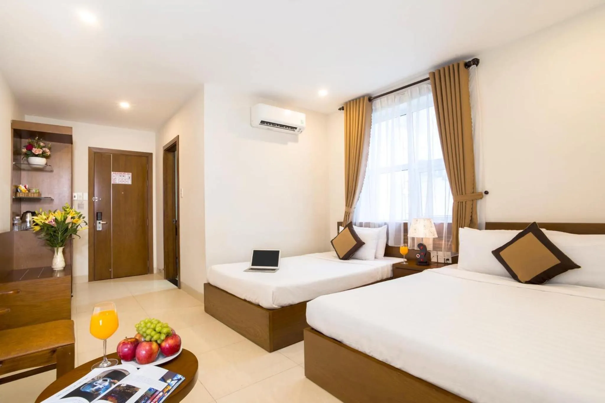 Bed in Golden Light Da Nang Hotel