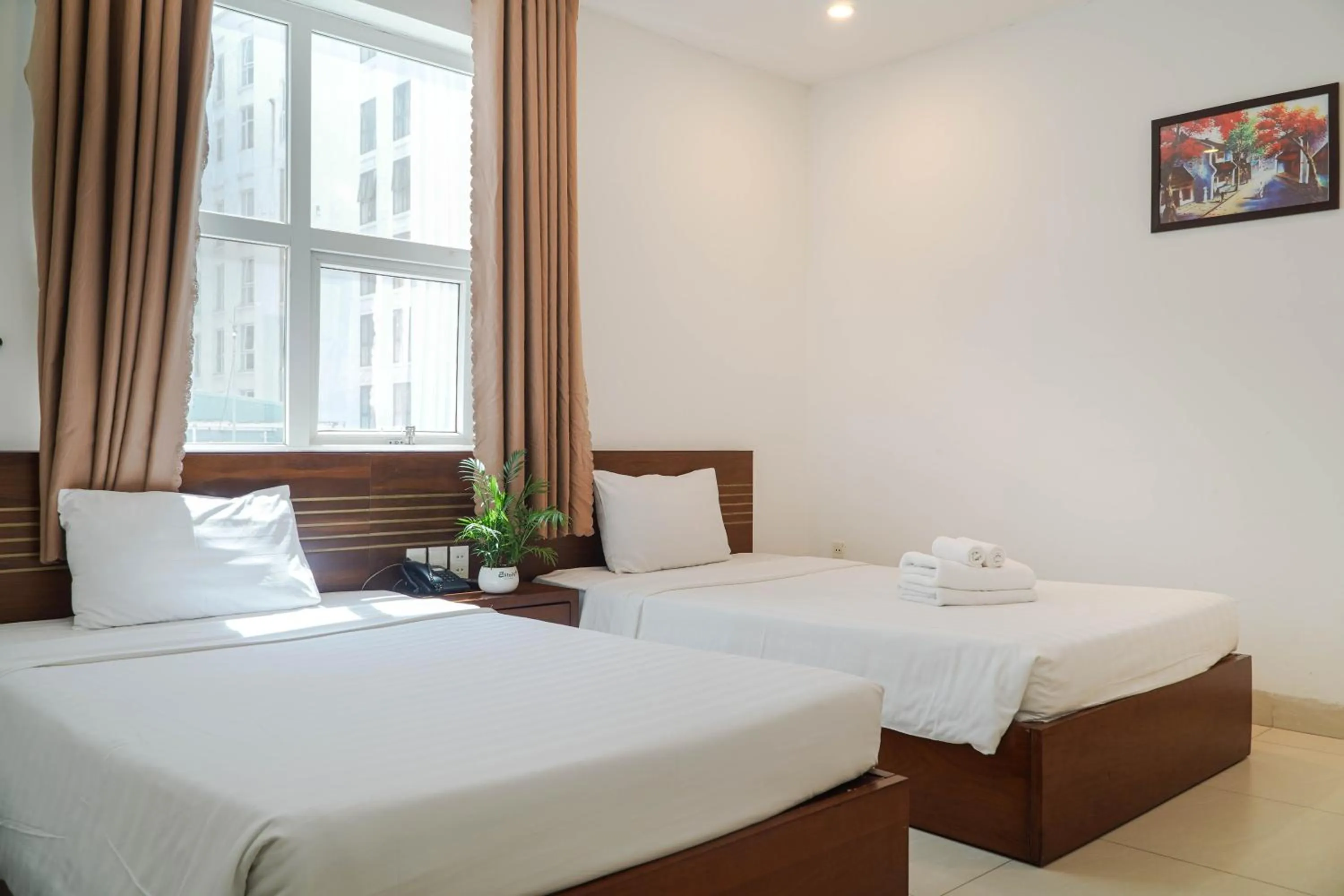 Bed in Golden Light Da Nang Hotel