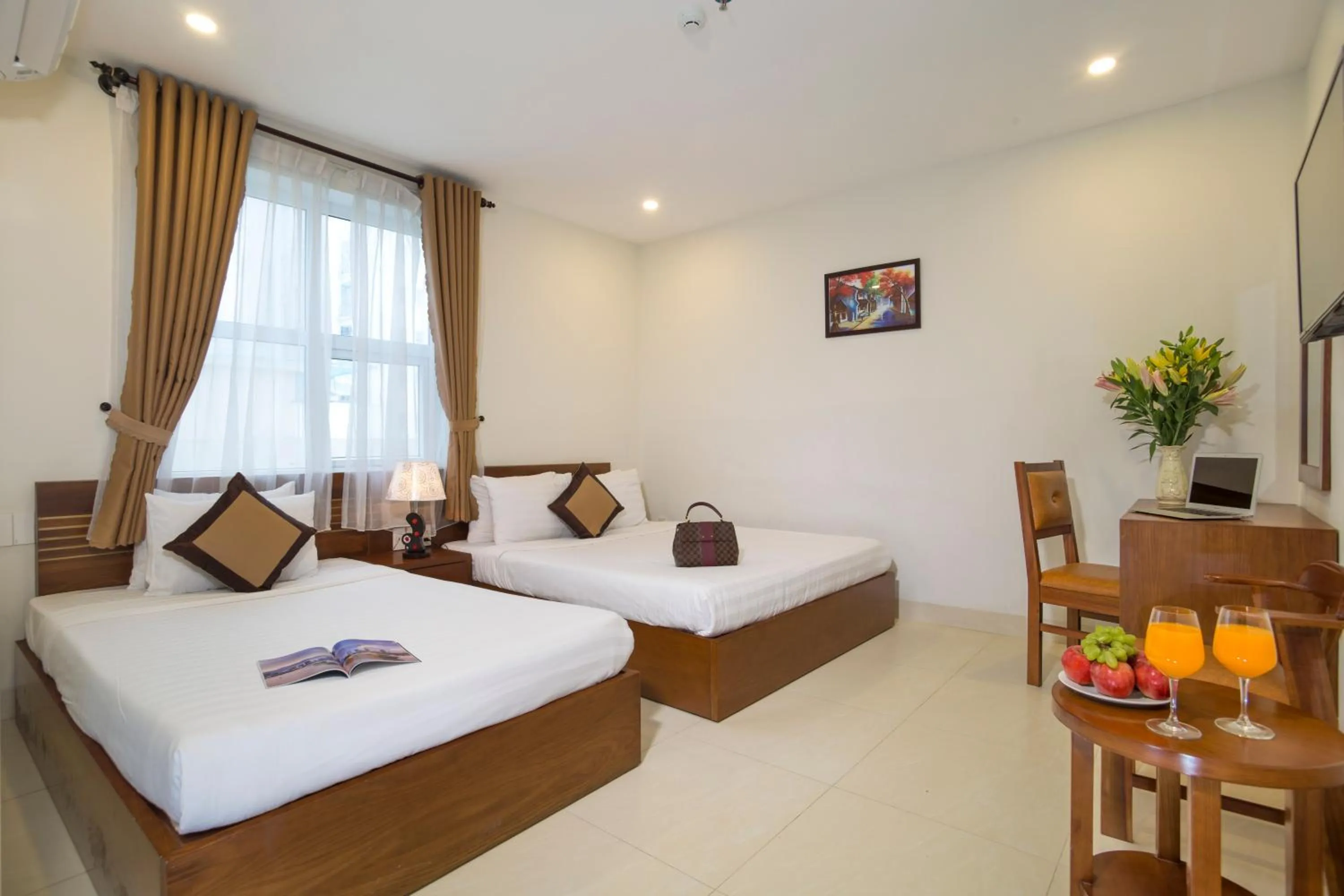 Bed in Golden Light Da Nang Hotel