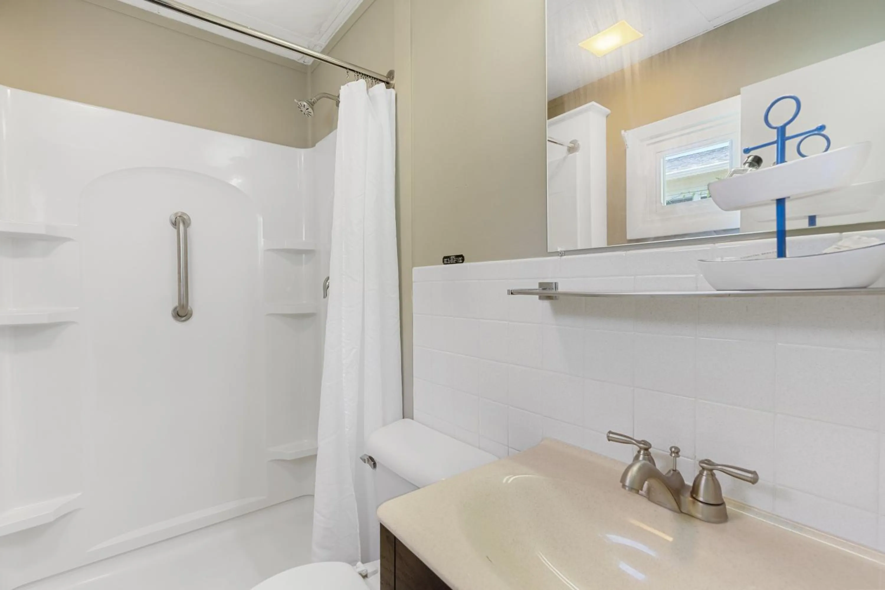 Shower in The Beaches Guestrooms and Cottages