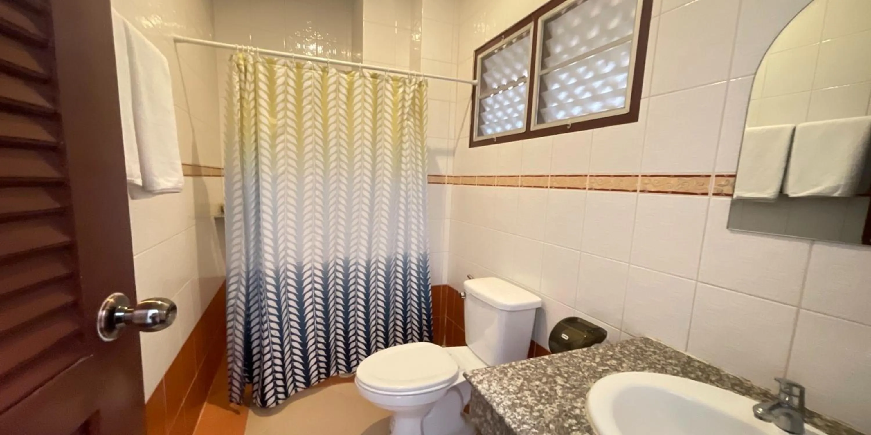 Toilet in Yellow Tique Hotel