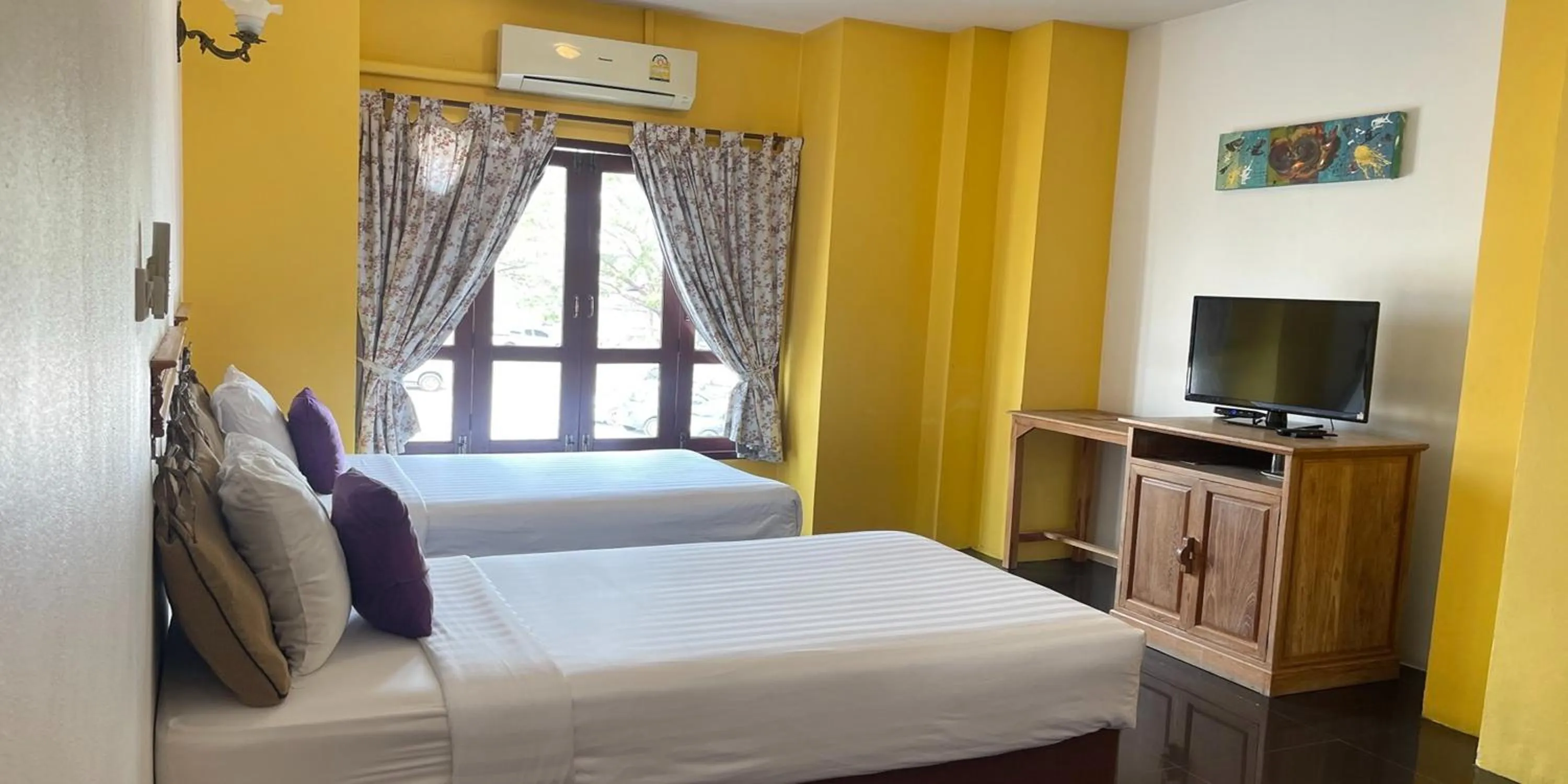 Bed in Yellow Tique Hotel