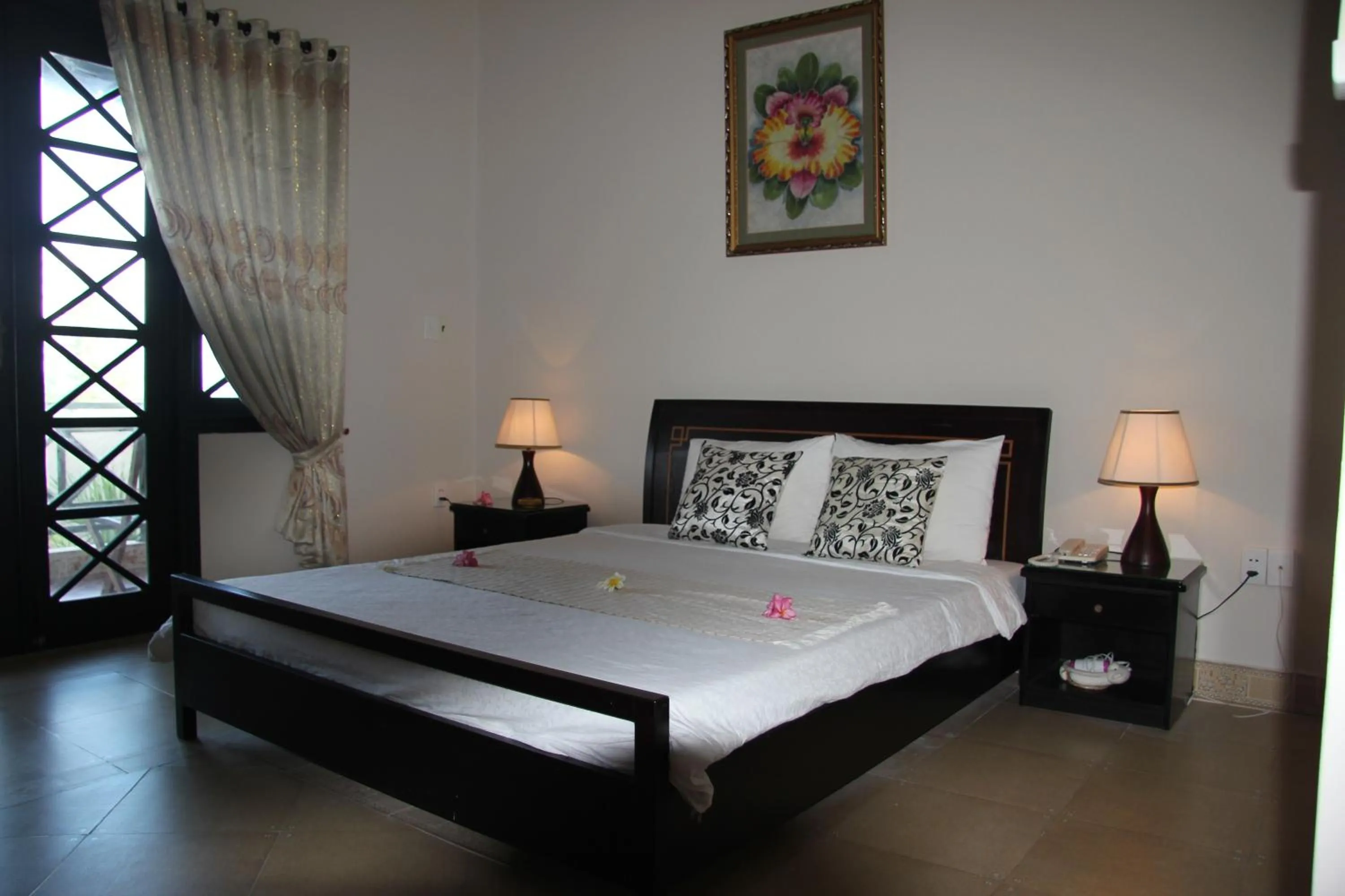 Bed in Orchid Boutique Beach Resort