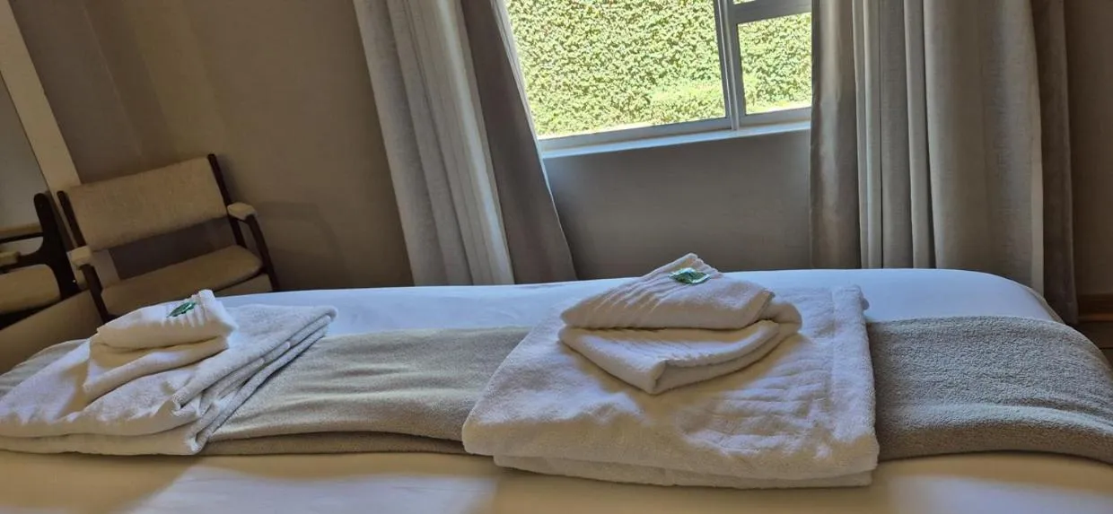 Bedroom, Bed in Elegant Lodge & Conference Center