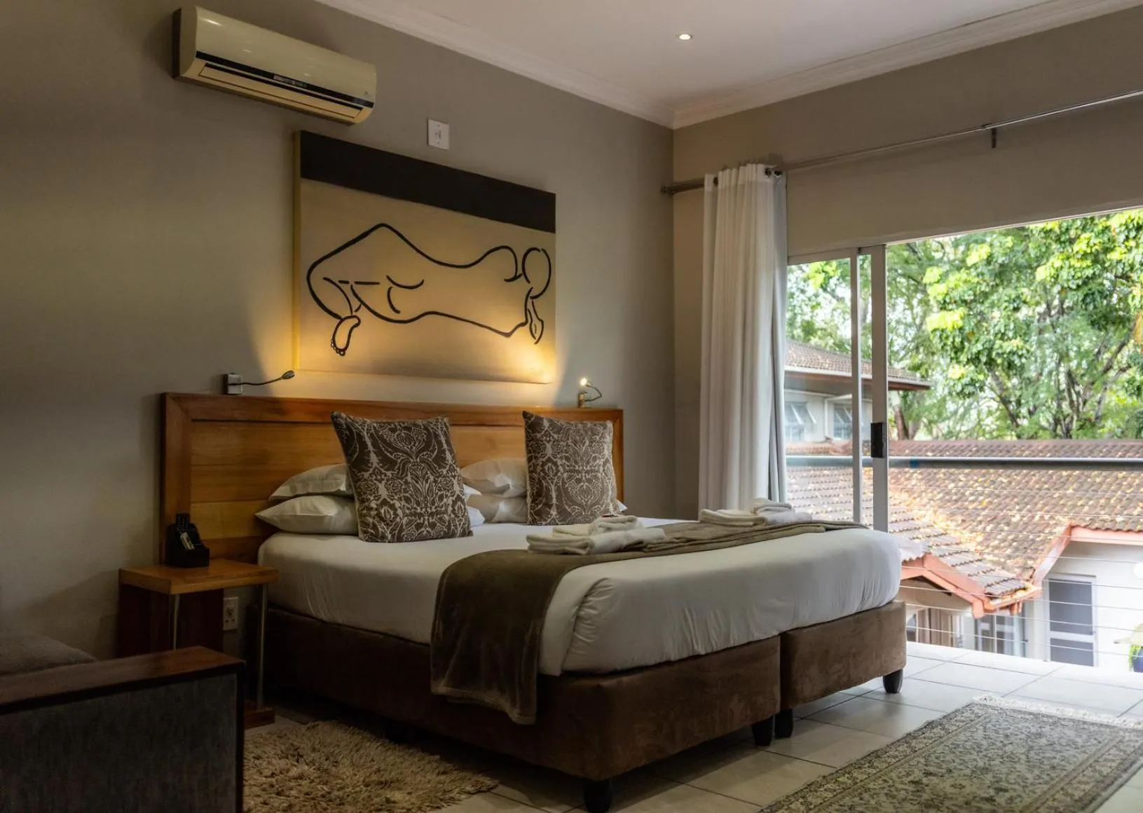 Bedroom, Bed in Elegant Lodge & Conference Center