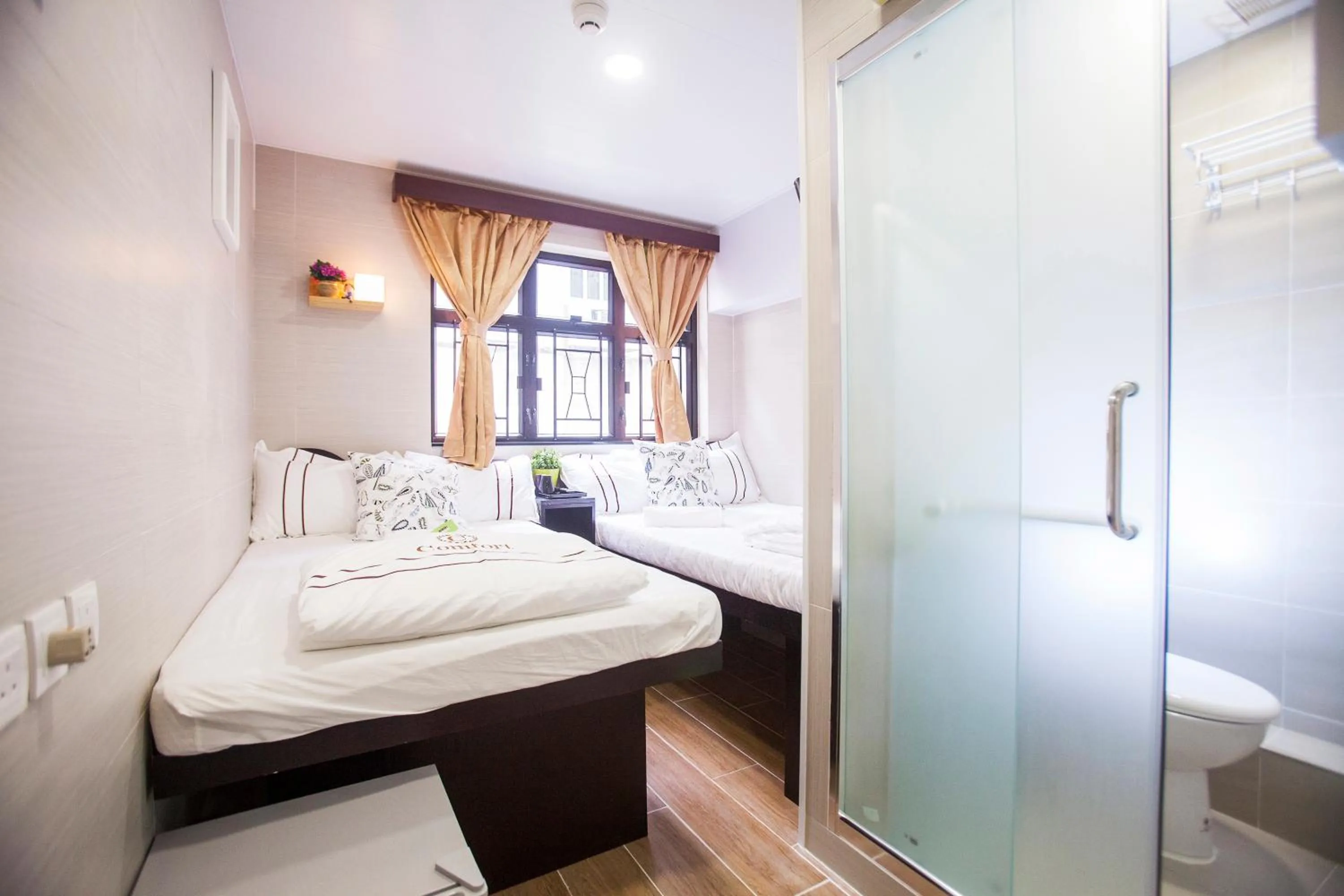 Bed in Joyous Guest House