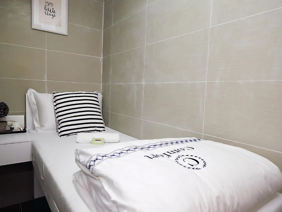 Bed in Joyous Guest House