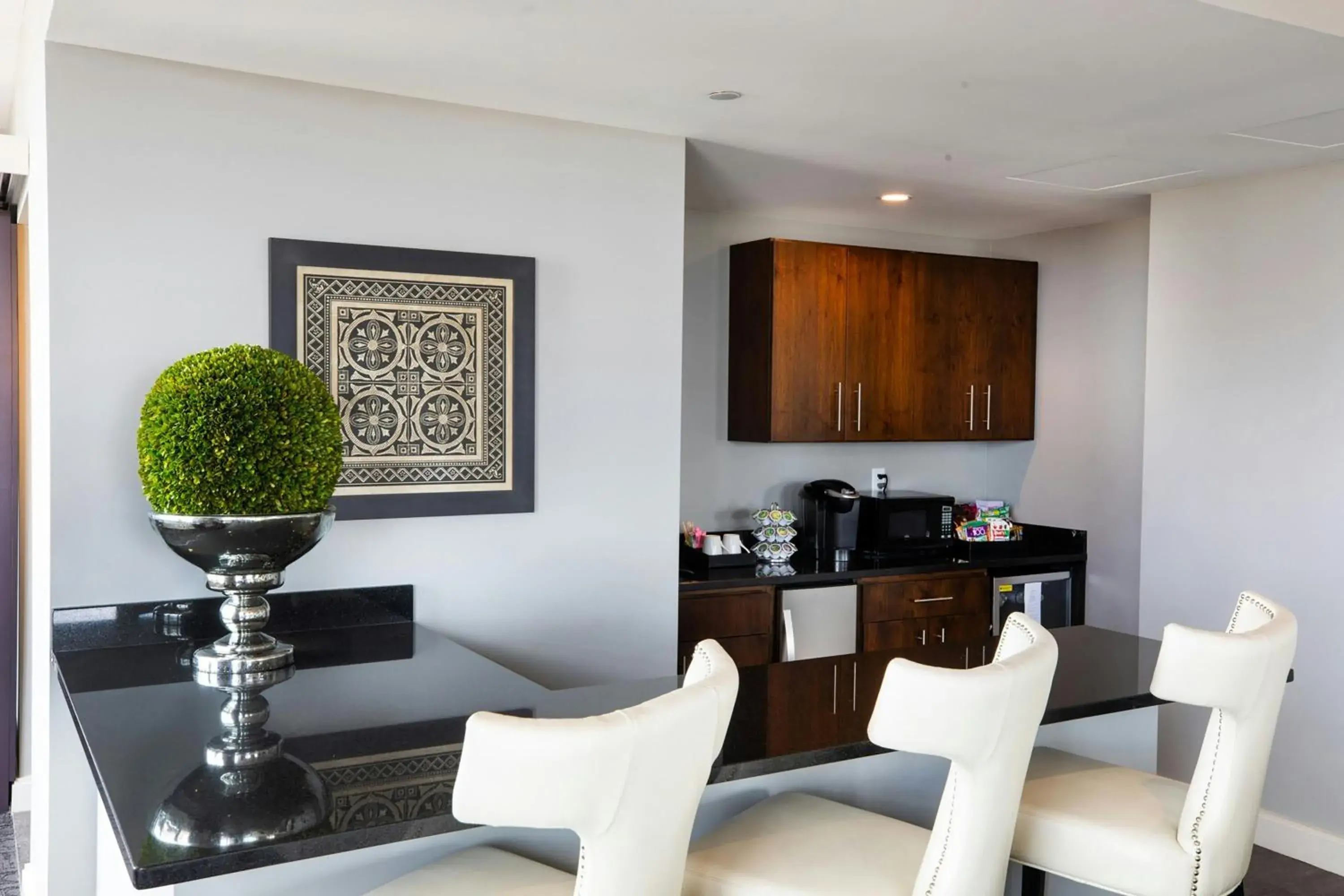 Kitchen or kitchenette in Ambassador Hotel Wichita, Autograph Collection Kitchen or kitchenette in Ambassador Hotel Wichita, Autograph Collection