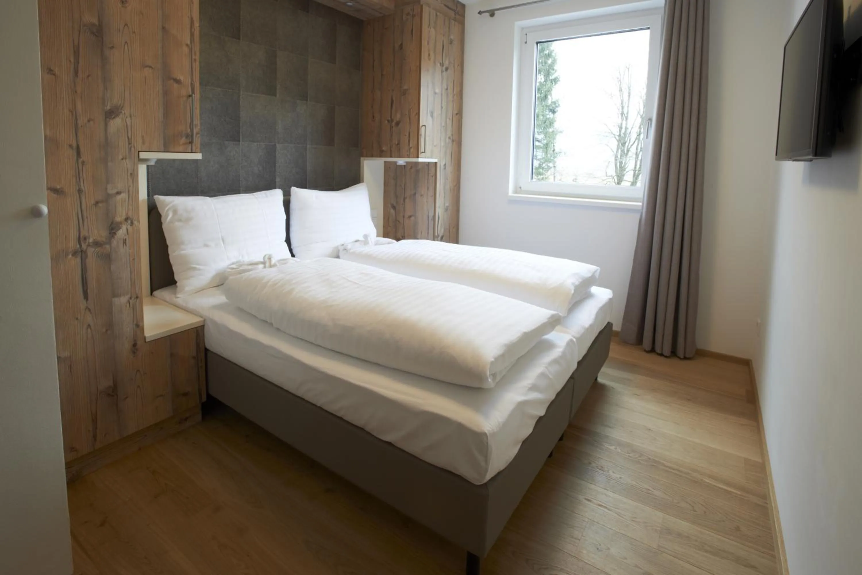 Bed in Ski & Golf Suites Zell am See by Alpin Rentals