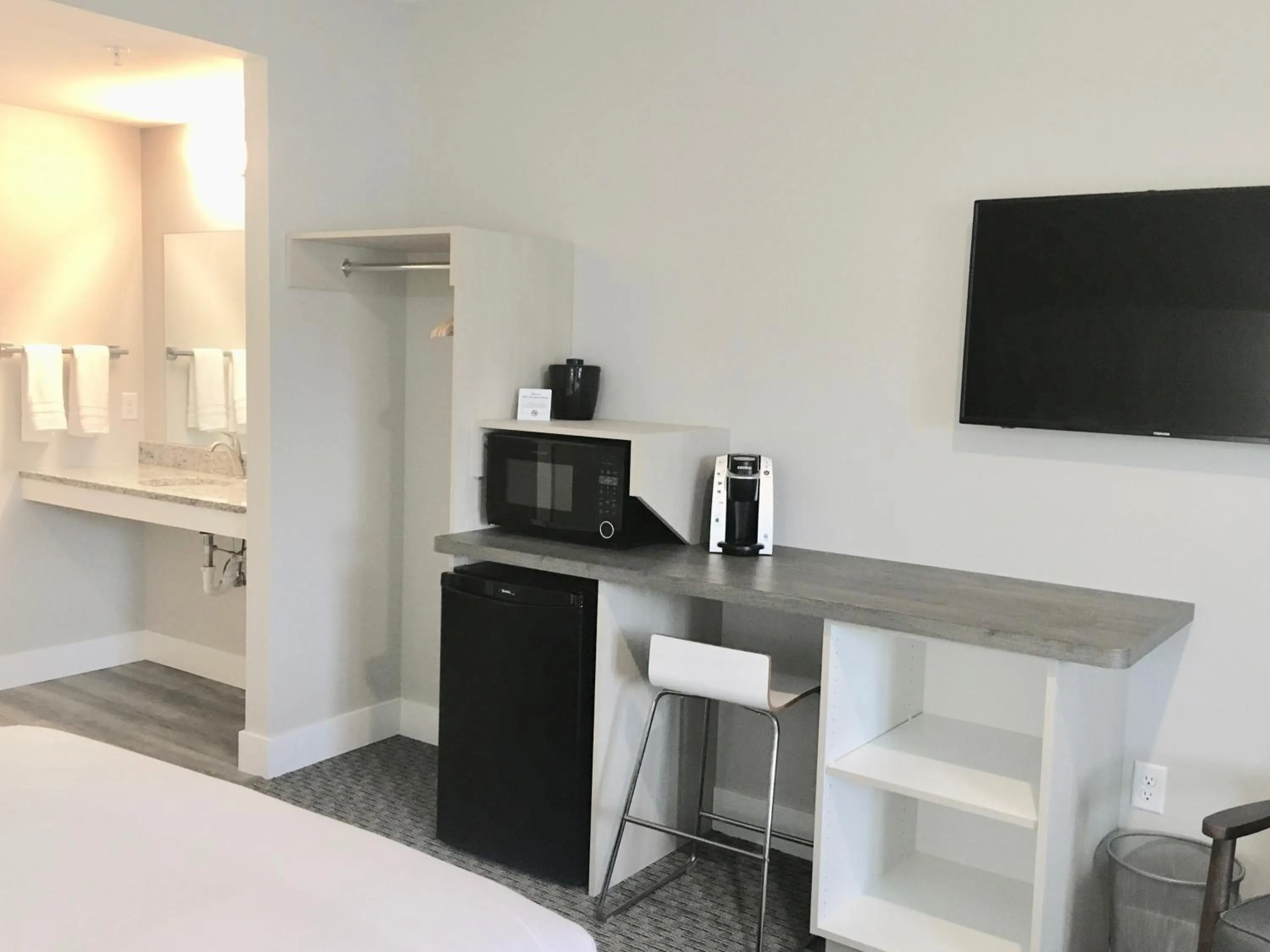 Bed in Empire Lakeshore Inn