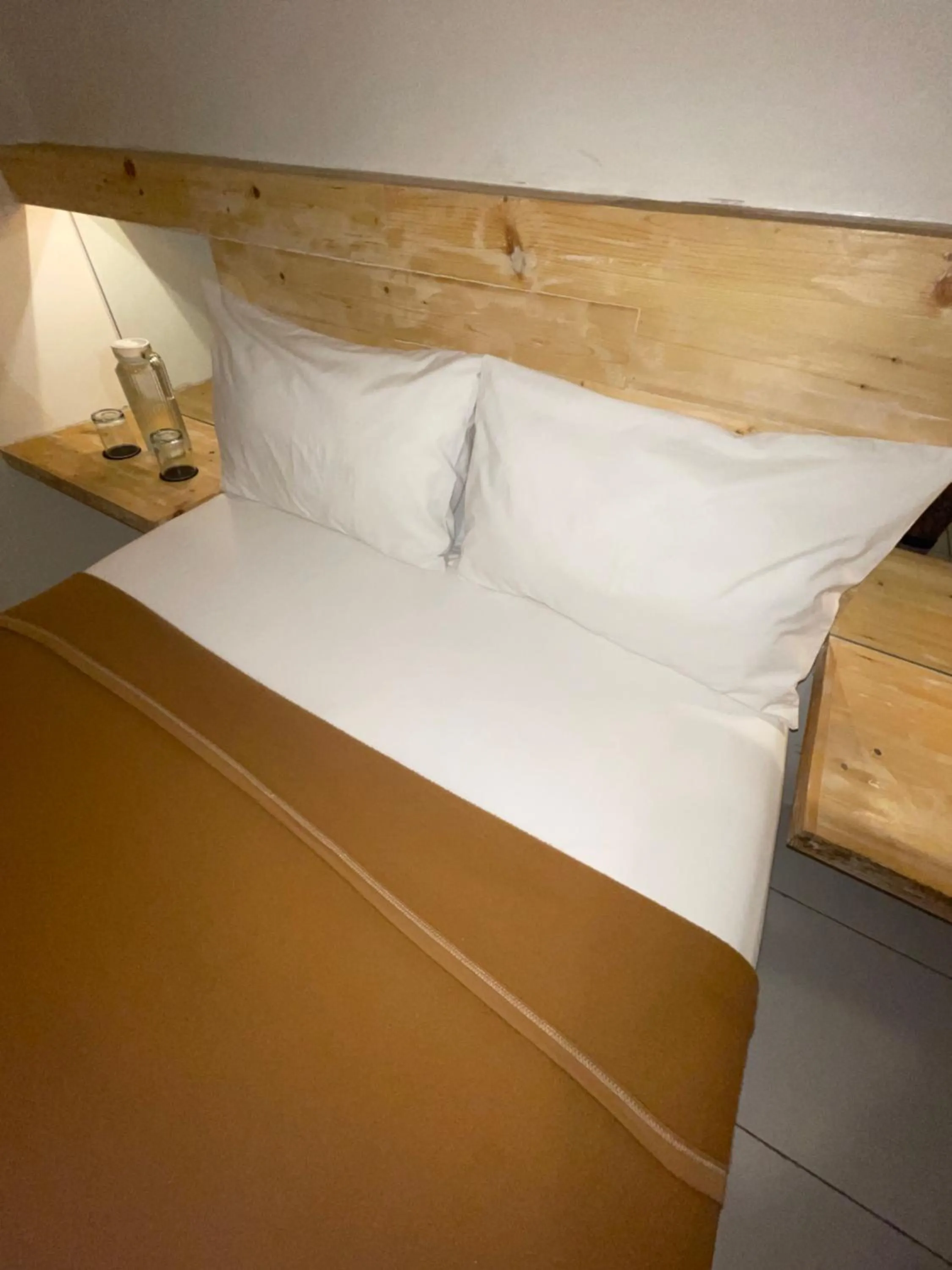 Bed in TANAWU AIRPORT HOTEL LOMBOK