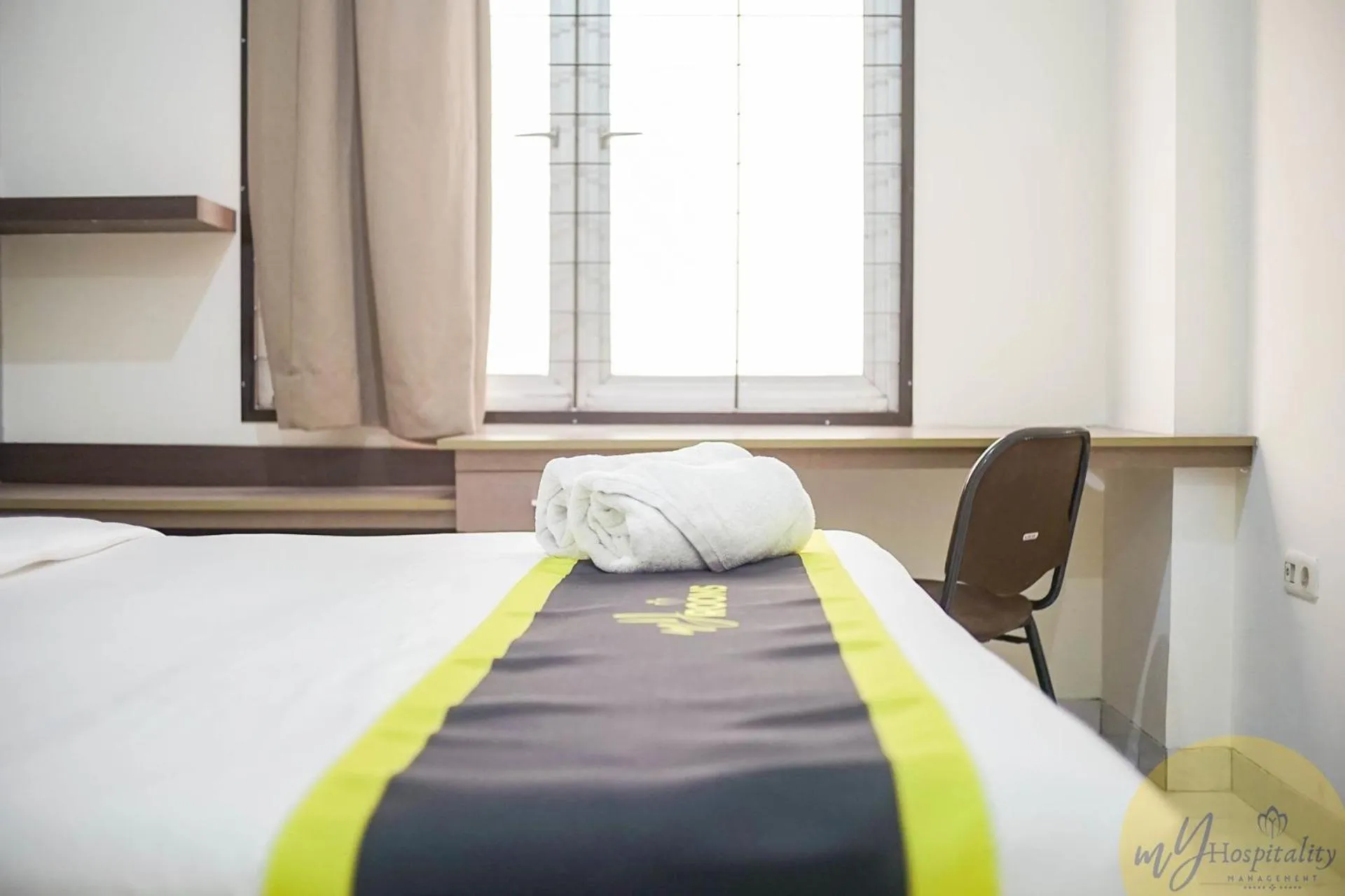 Bed in Fortuna Hotel & Residence by My Hospitality