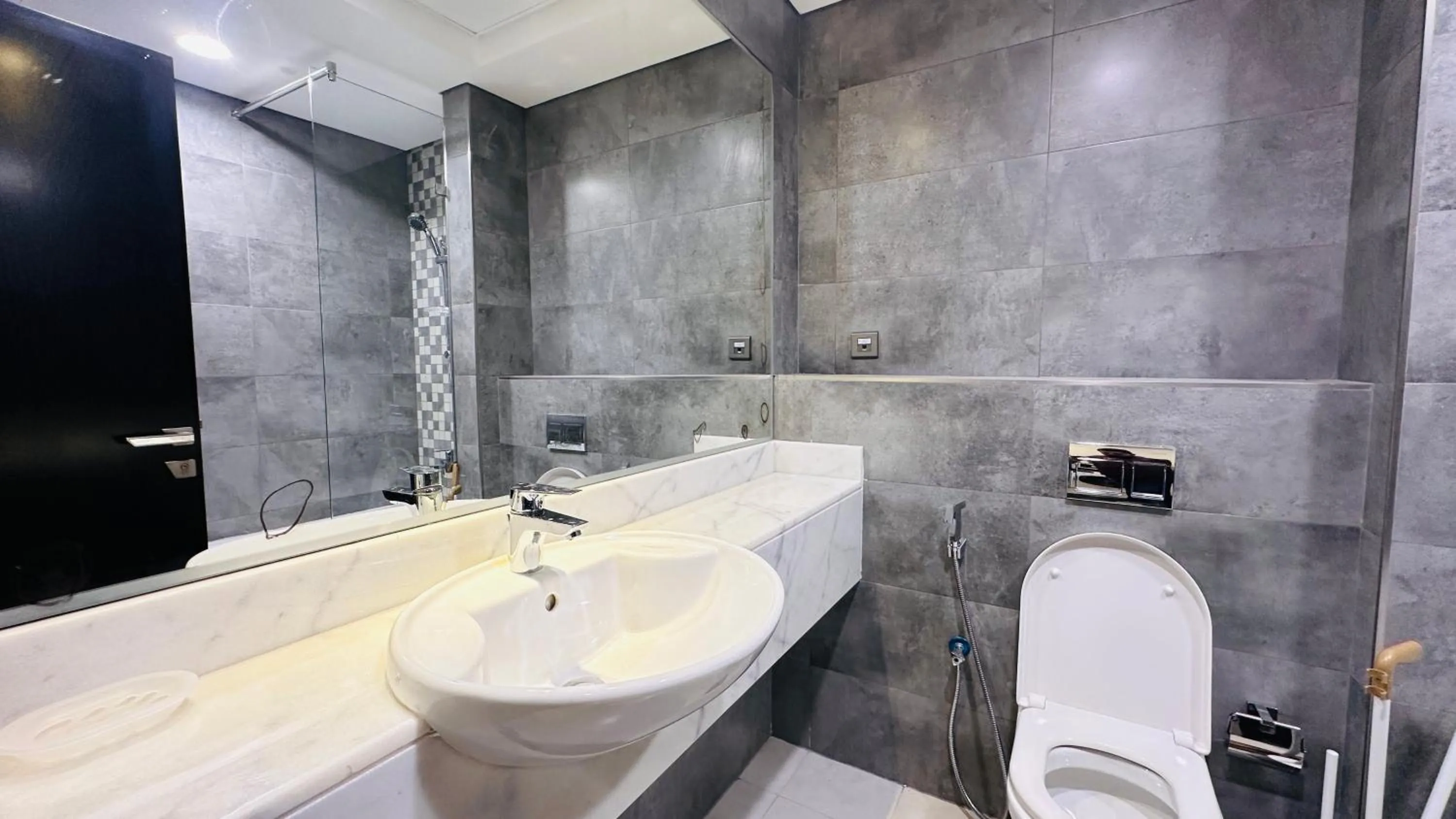 Bathroom in Luxurious Studio Apartment Burj View with Balcony Free Parking by Belvilla