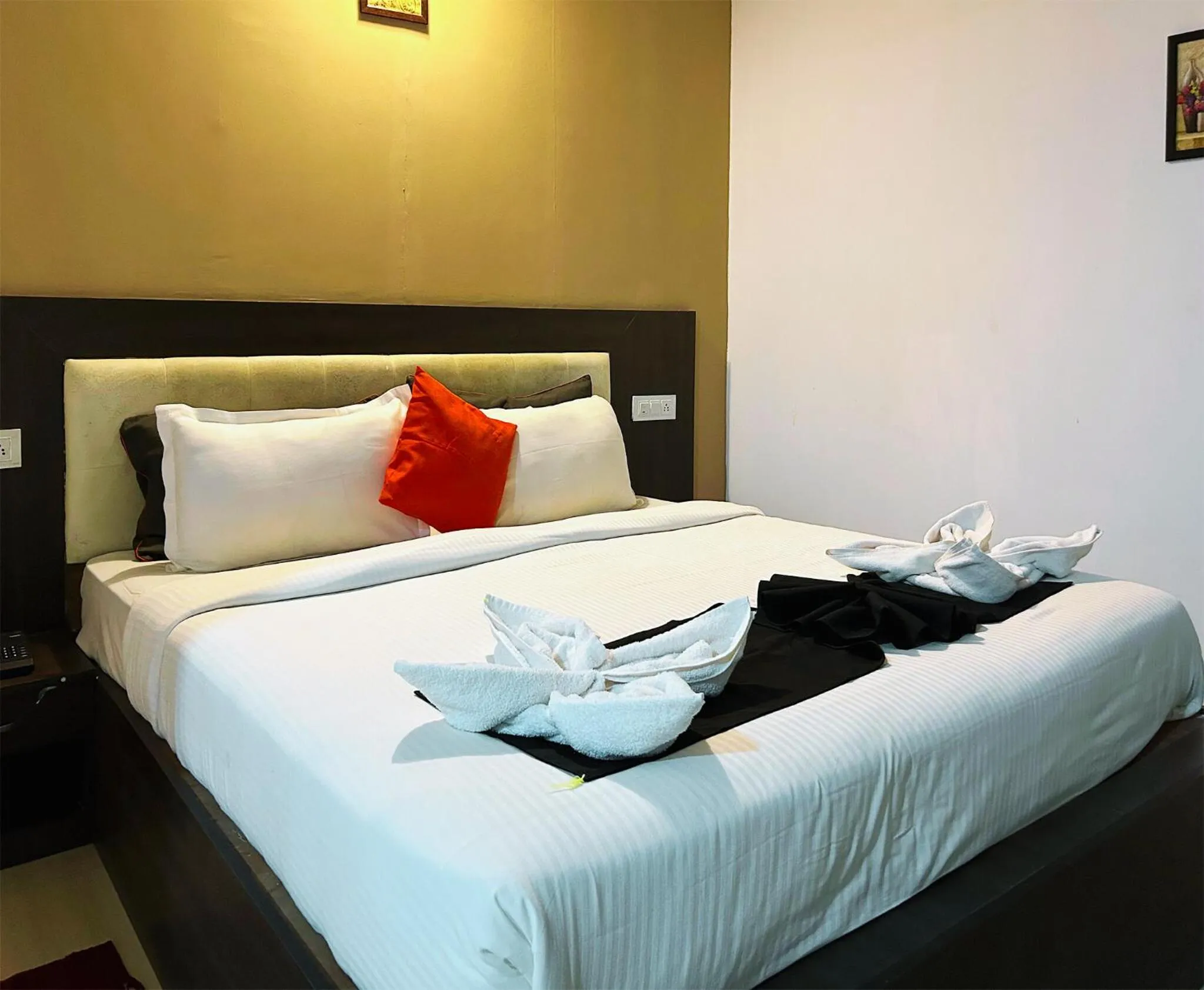 Bed in Bay Breeze Resorts & Hotels