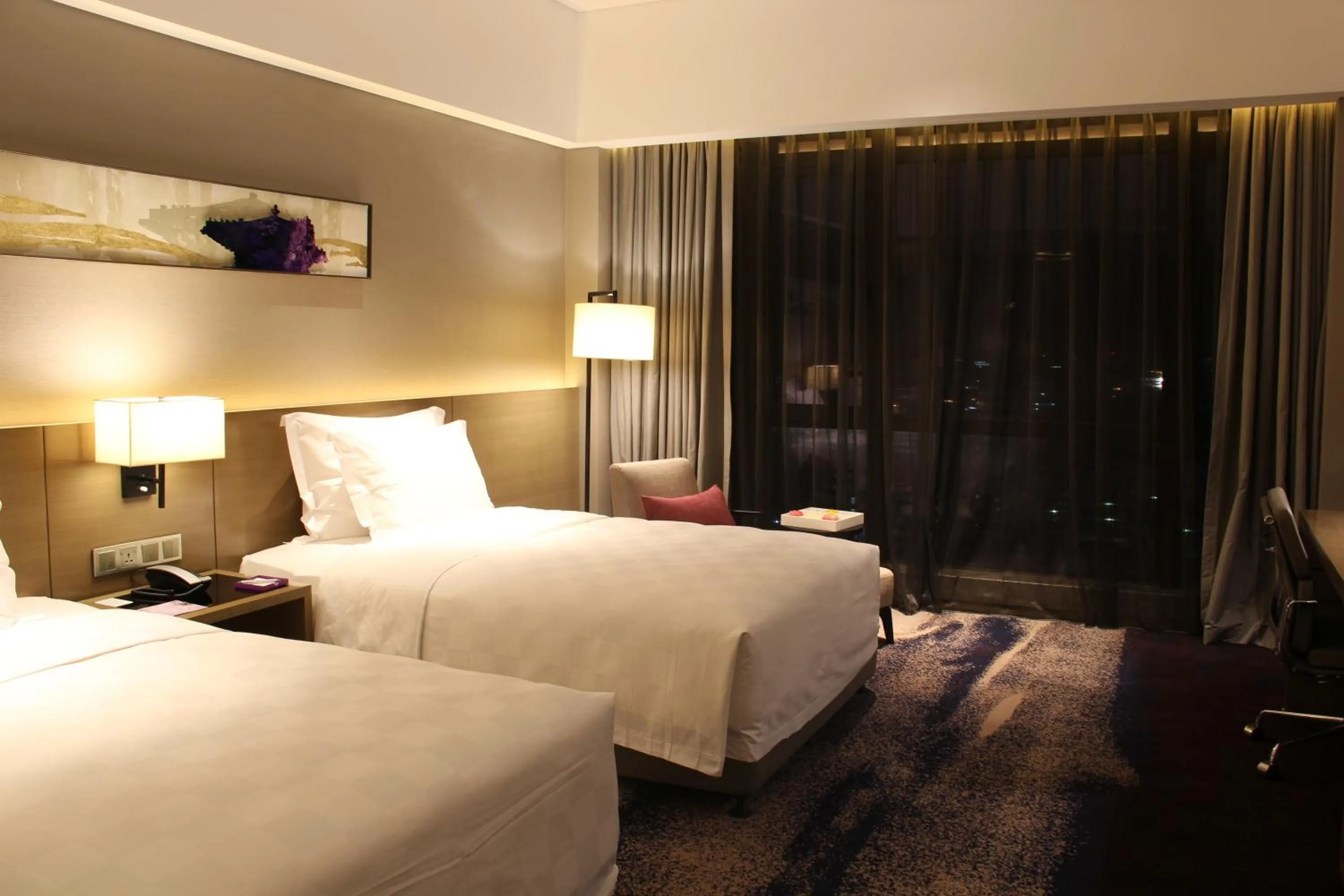 Bed in Wyndham JinJiang Hotel