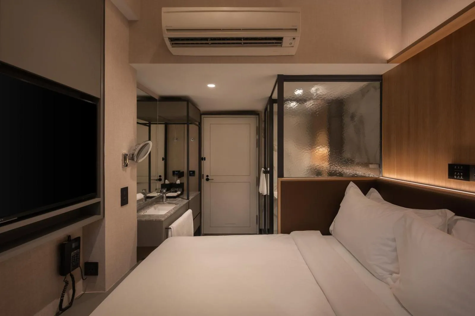 Bed in Claude Hotel