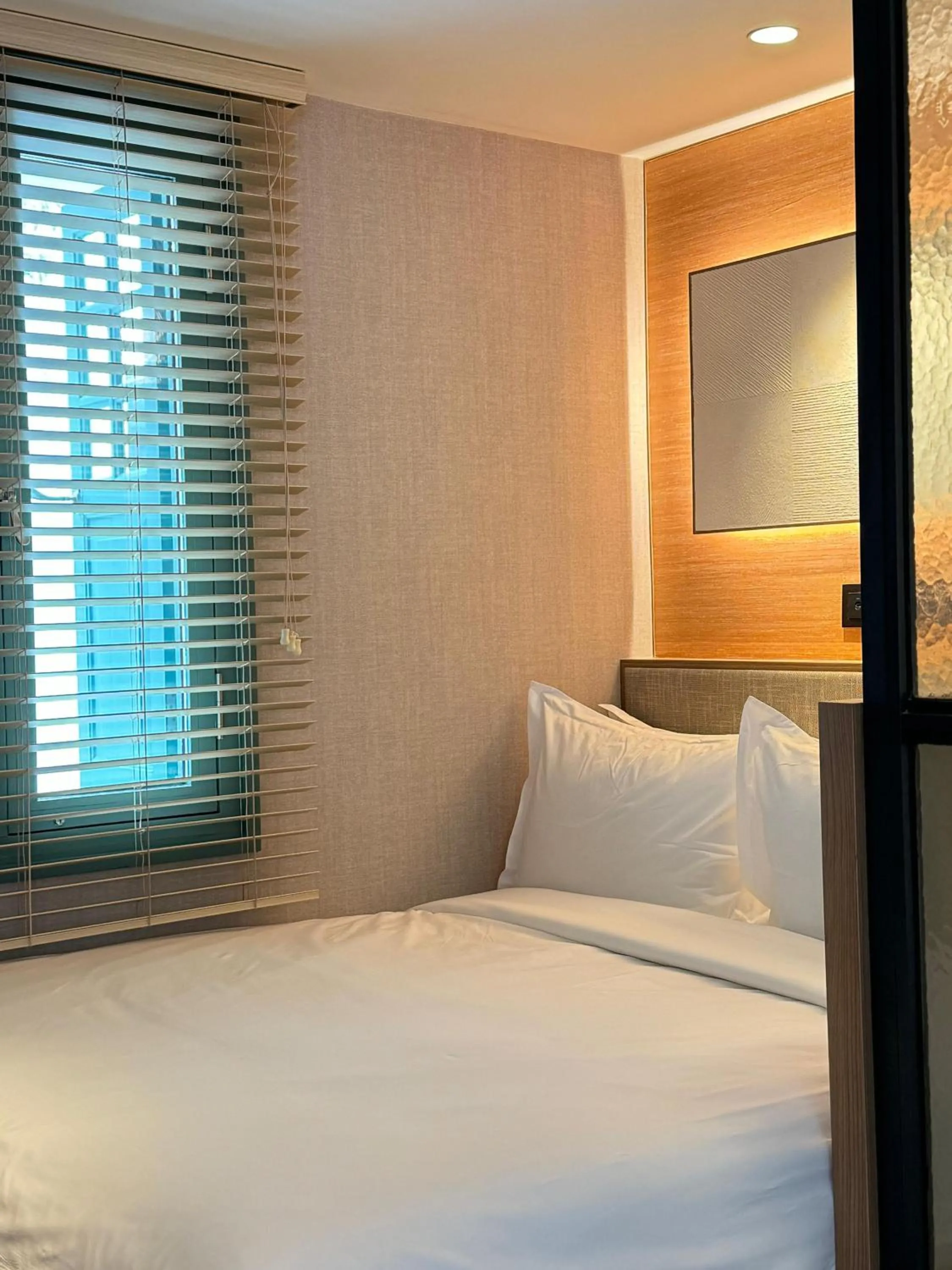 Bed in Claude Hotel