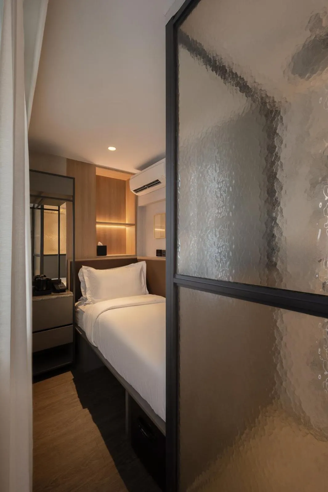 Bed in Claude Hotel
