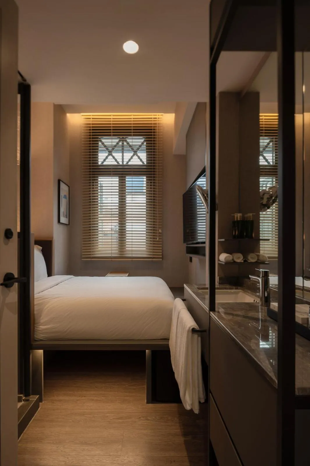 Bed in Claude Hotel