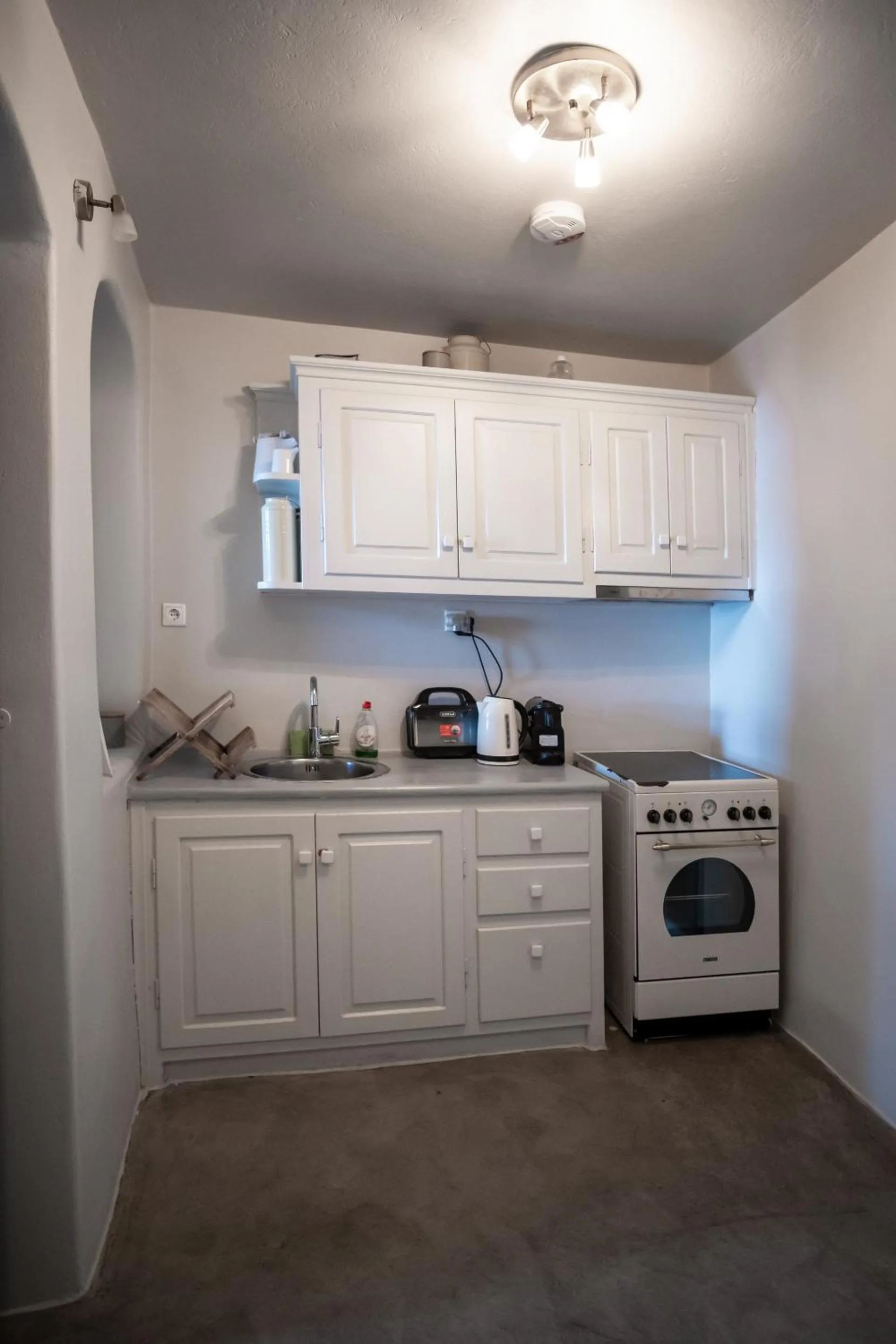 Kitchen or kitchenette in Alafouzou Cave Loft