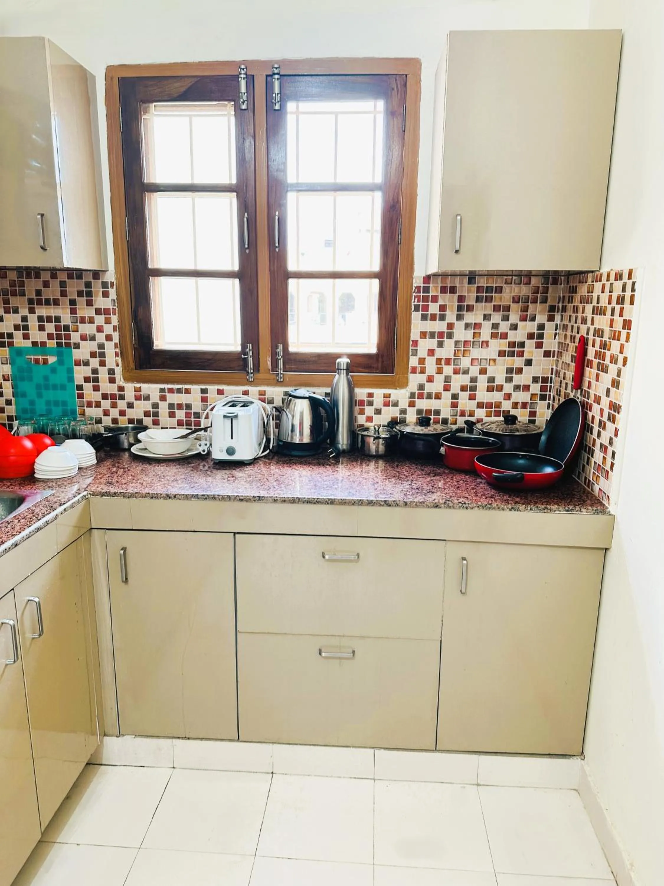 Kitchen or kitchenette in ZoomStay - 3BHK Apartments