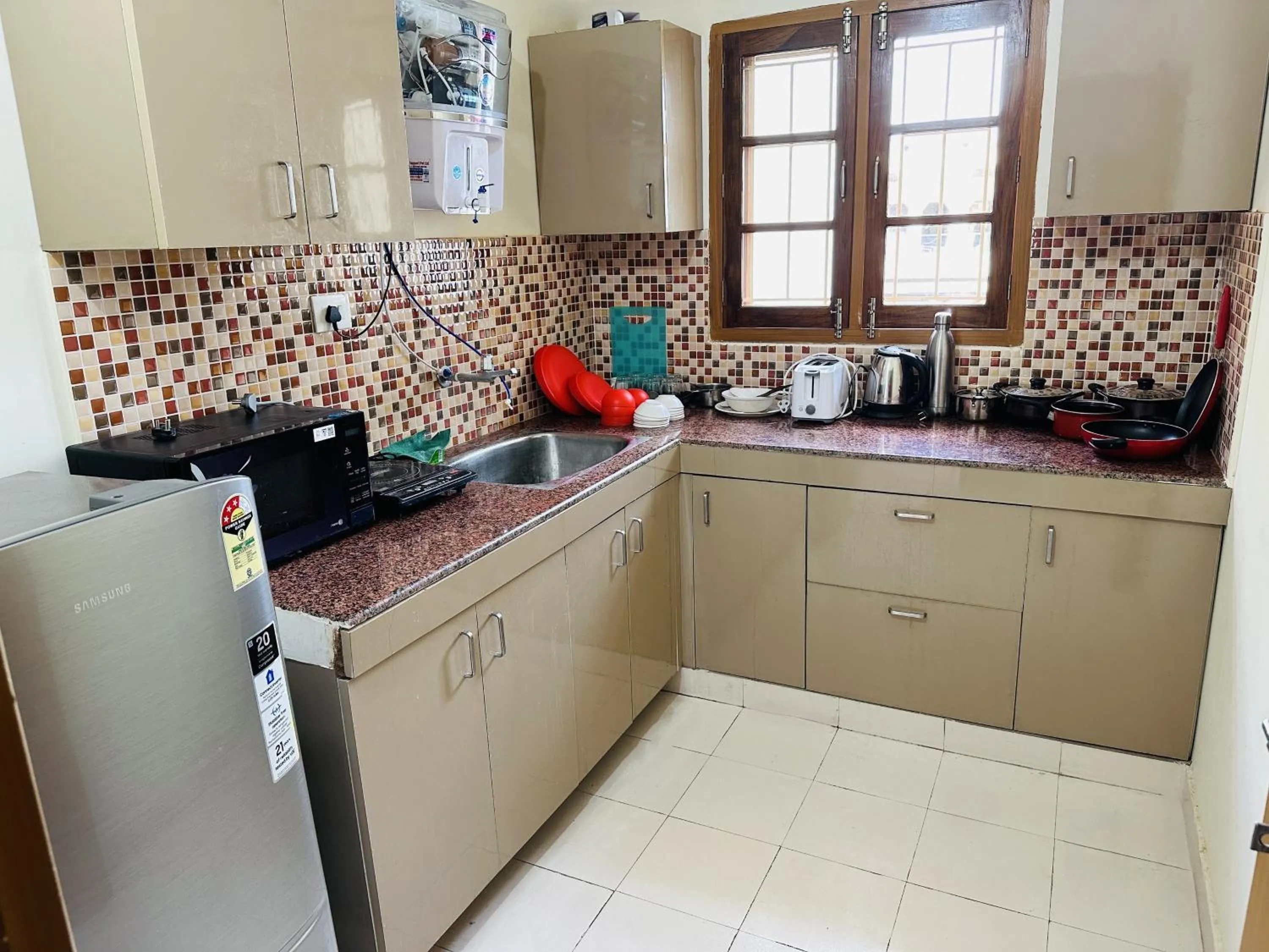 Kitchen or kitchenette in ZoomStay - 3BHK Apartments