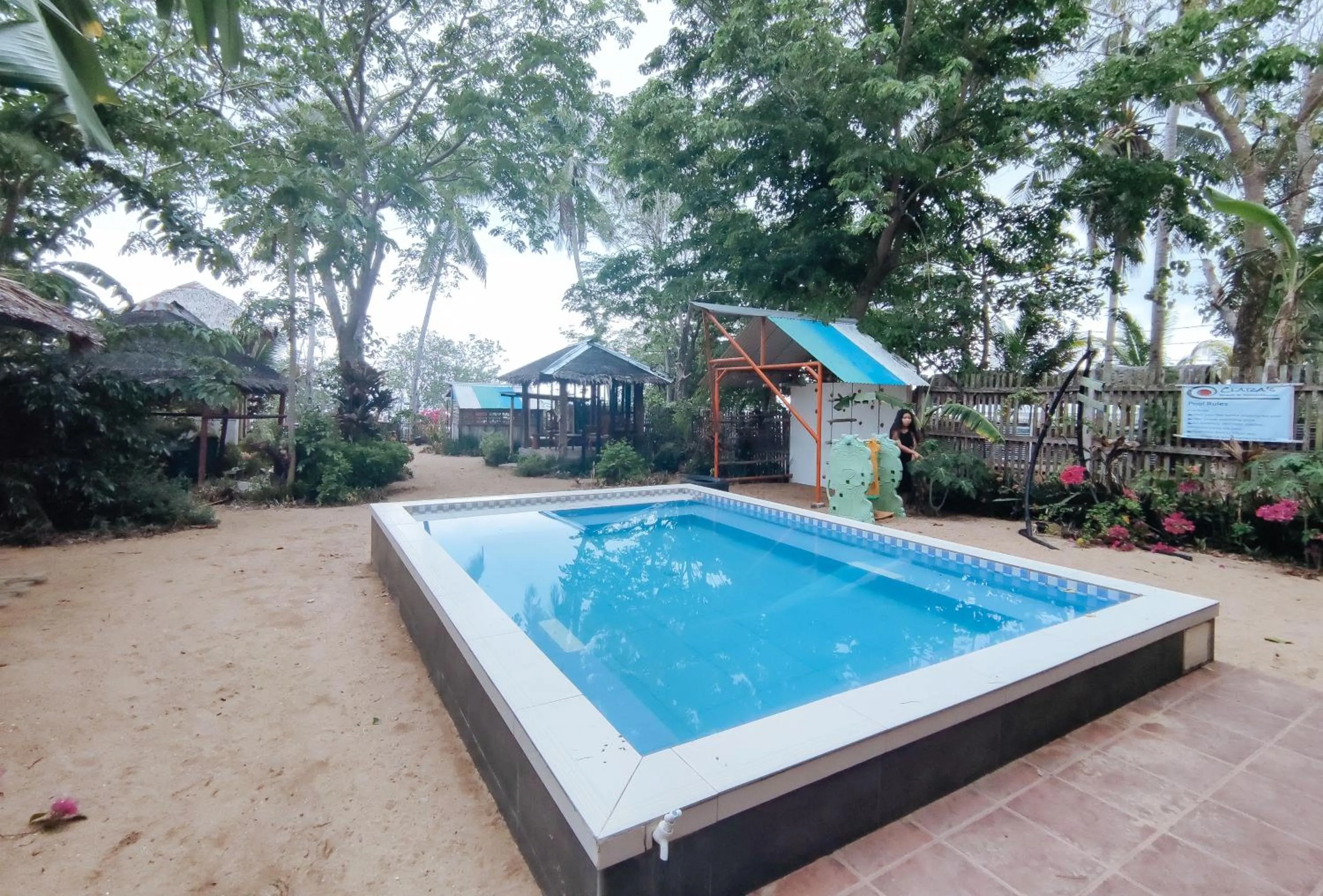 Swimming pool in The Clara Beach and Guest House