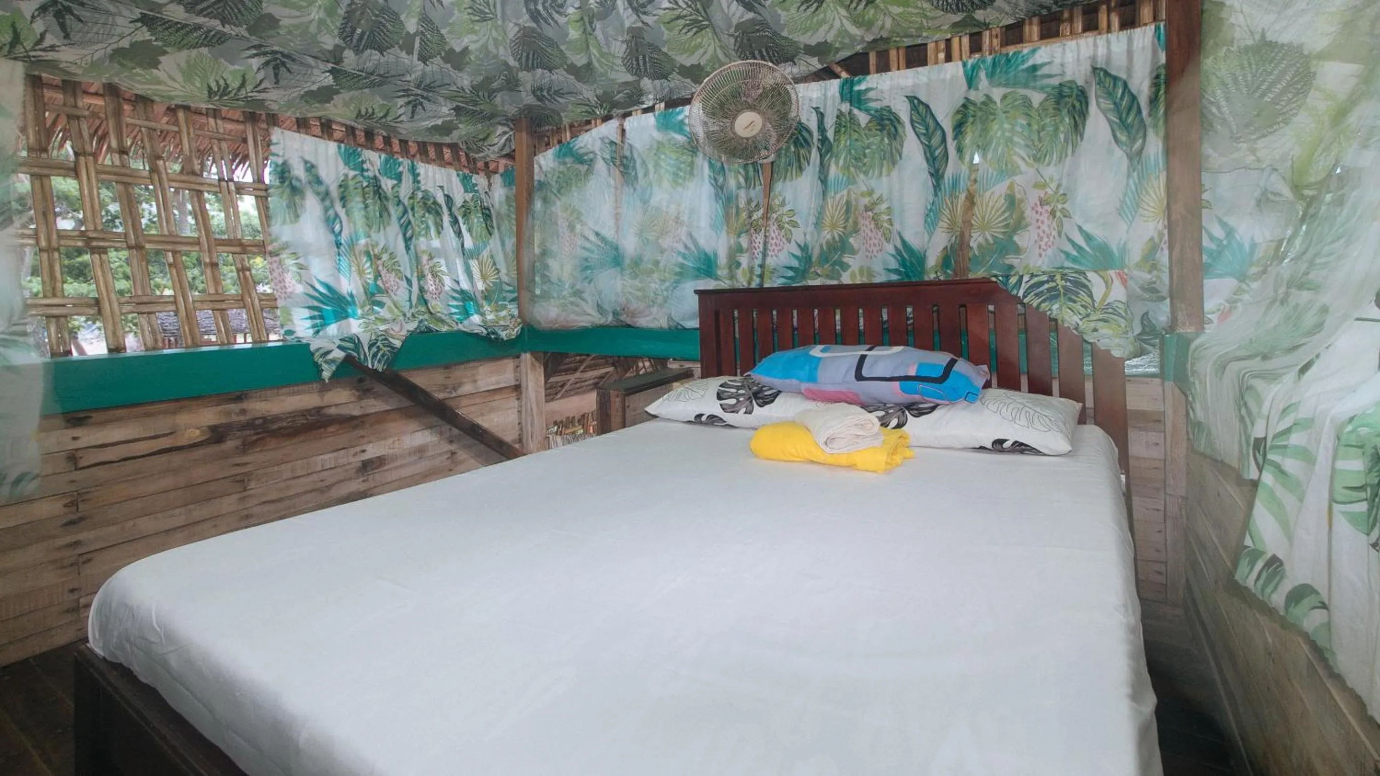 Bed in The Clara Beach and Guest House